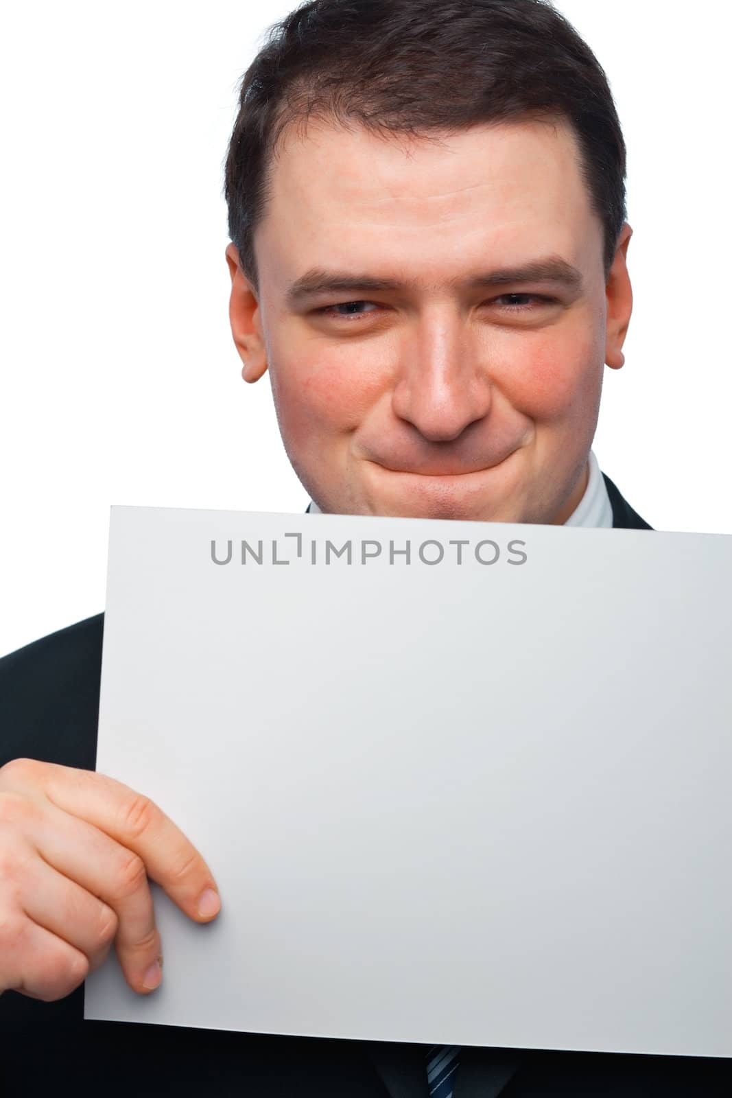 Closeup portrait of a young businessman holding a blank billboard on white 