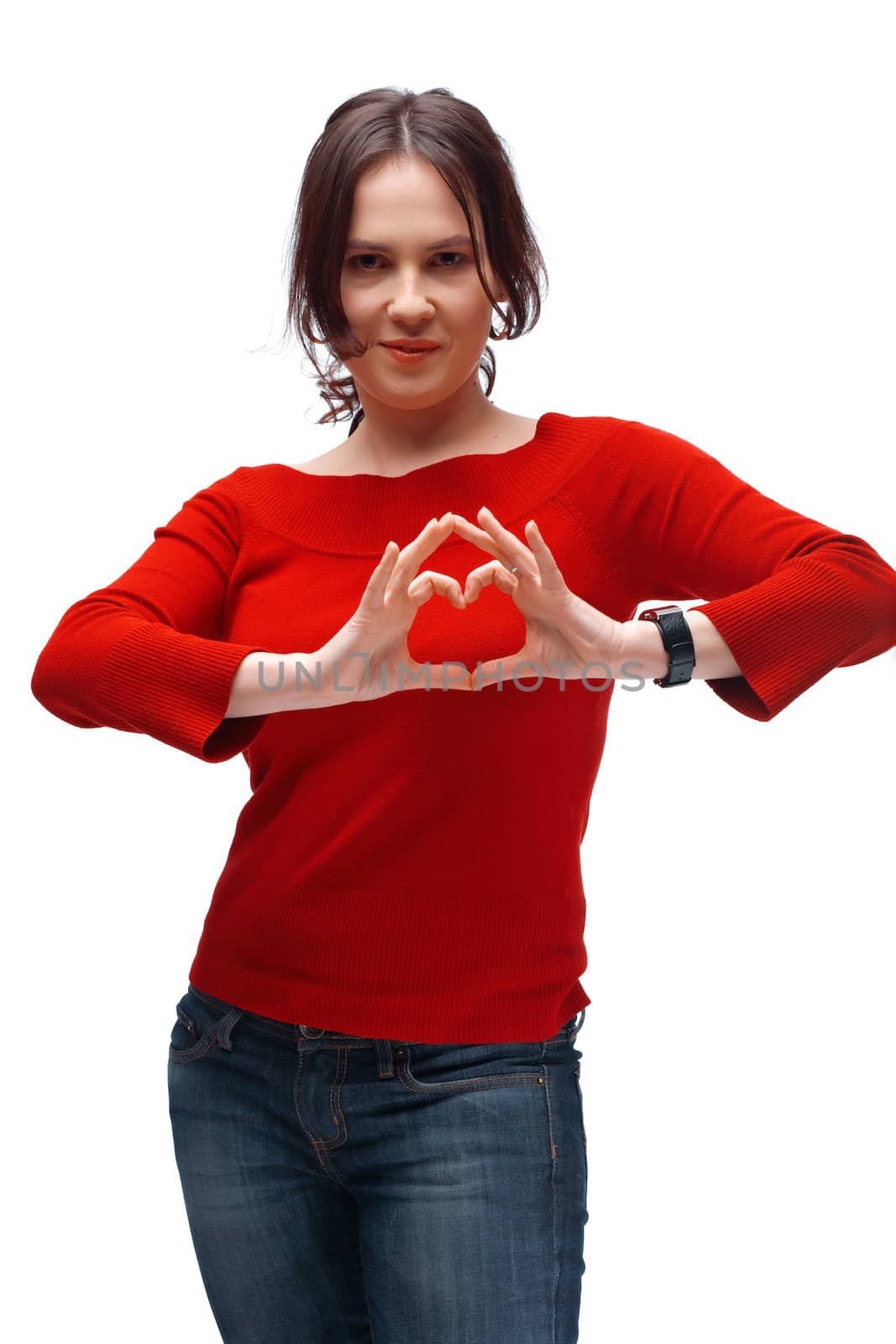 Portrait of a girl showing heart symbol isolated over white background 