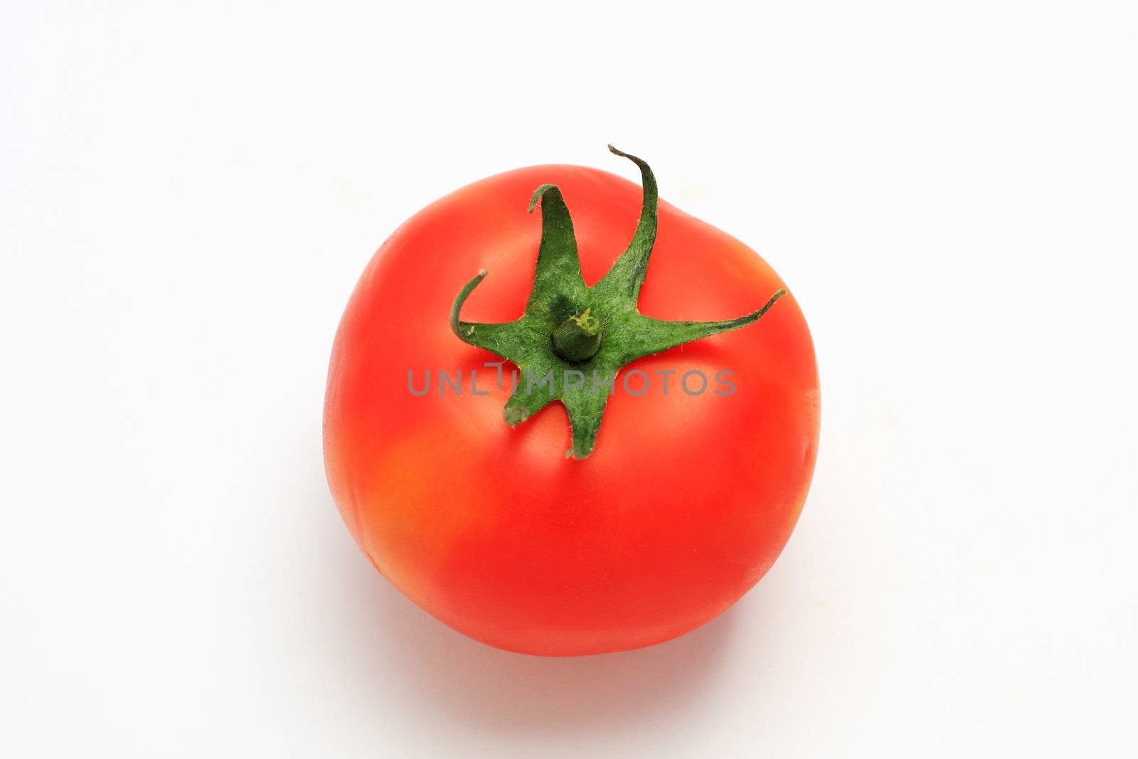 Red tomato shot from above, isolated on white, studio lighting