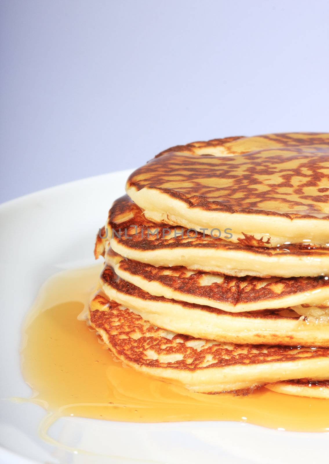 pile of american pancakes with syrup