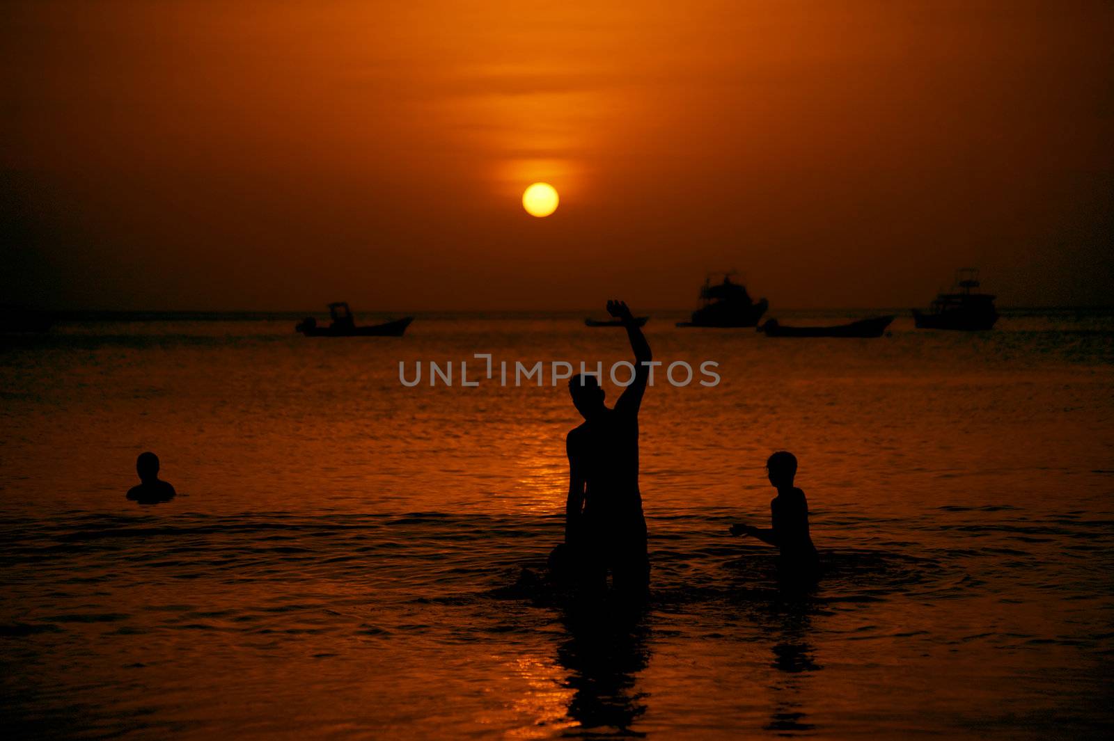 Swimmers at Sunset by Creatista
