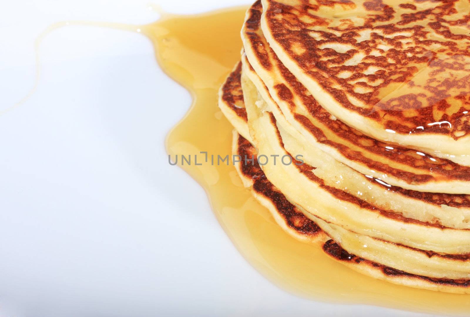 pile of american pancakes with syrup