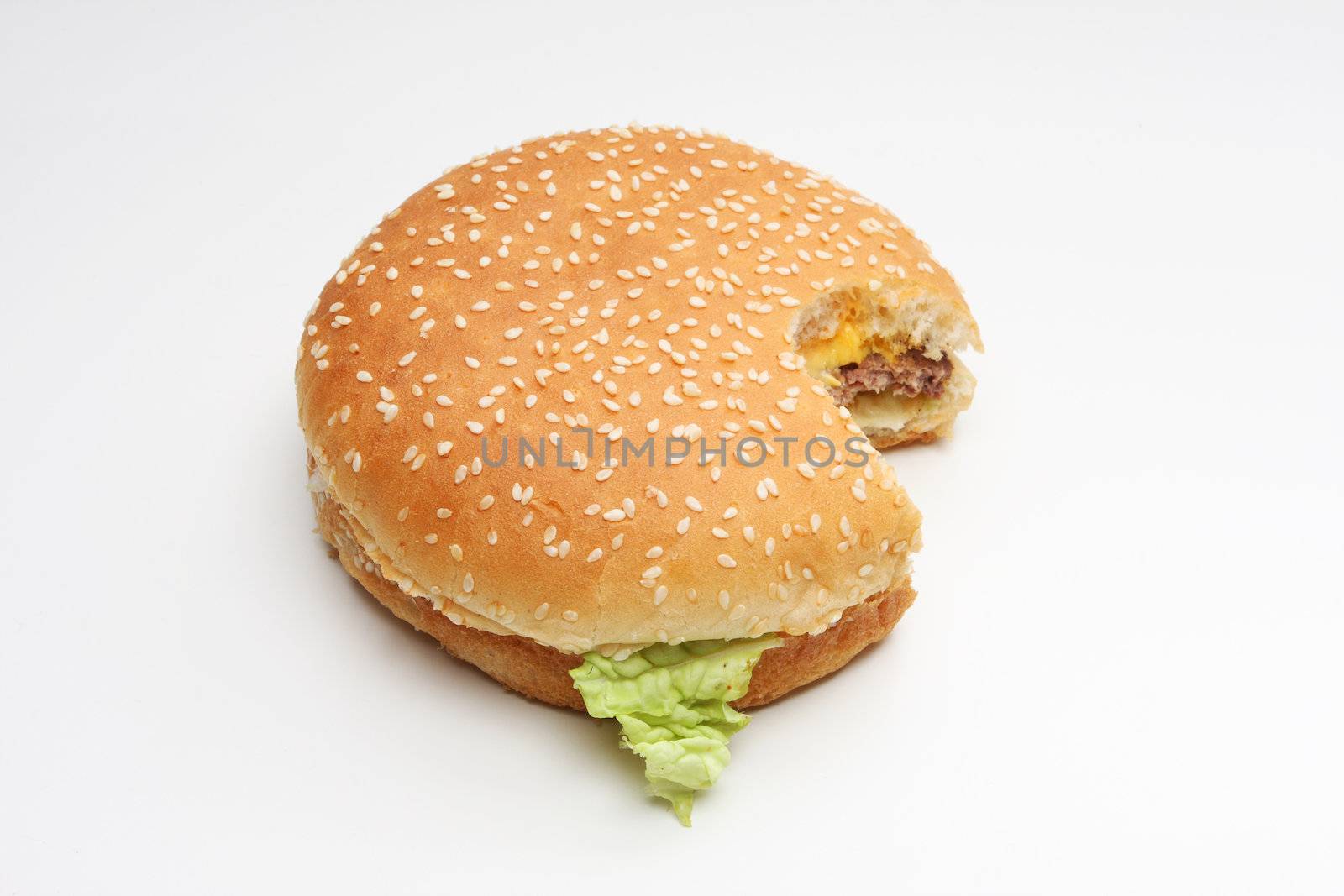 Hamburger isolated on white, one bite taken out of it