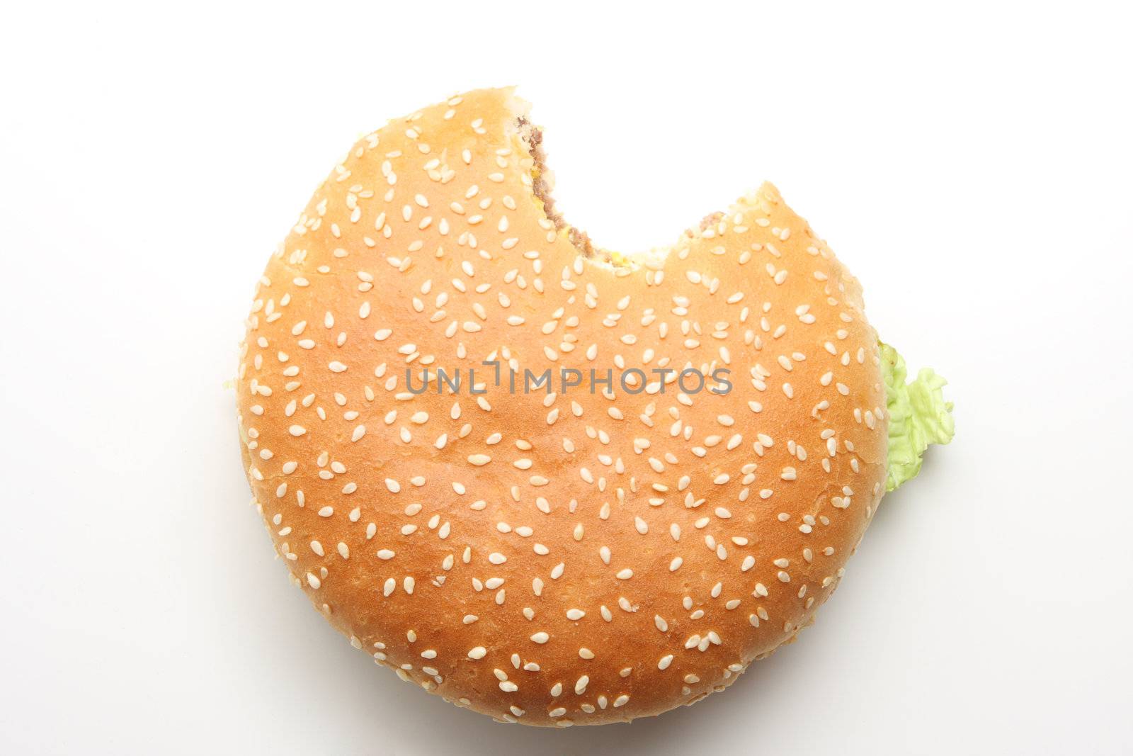 Hamburger isolated on white, one bite taken out of it