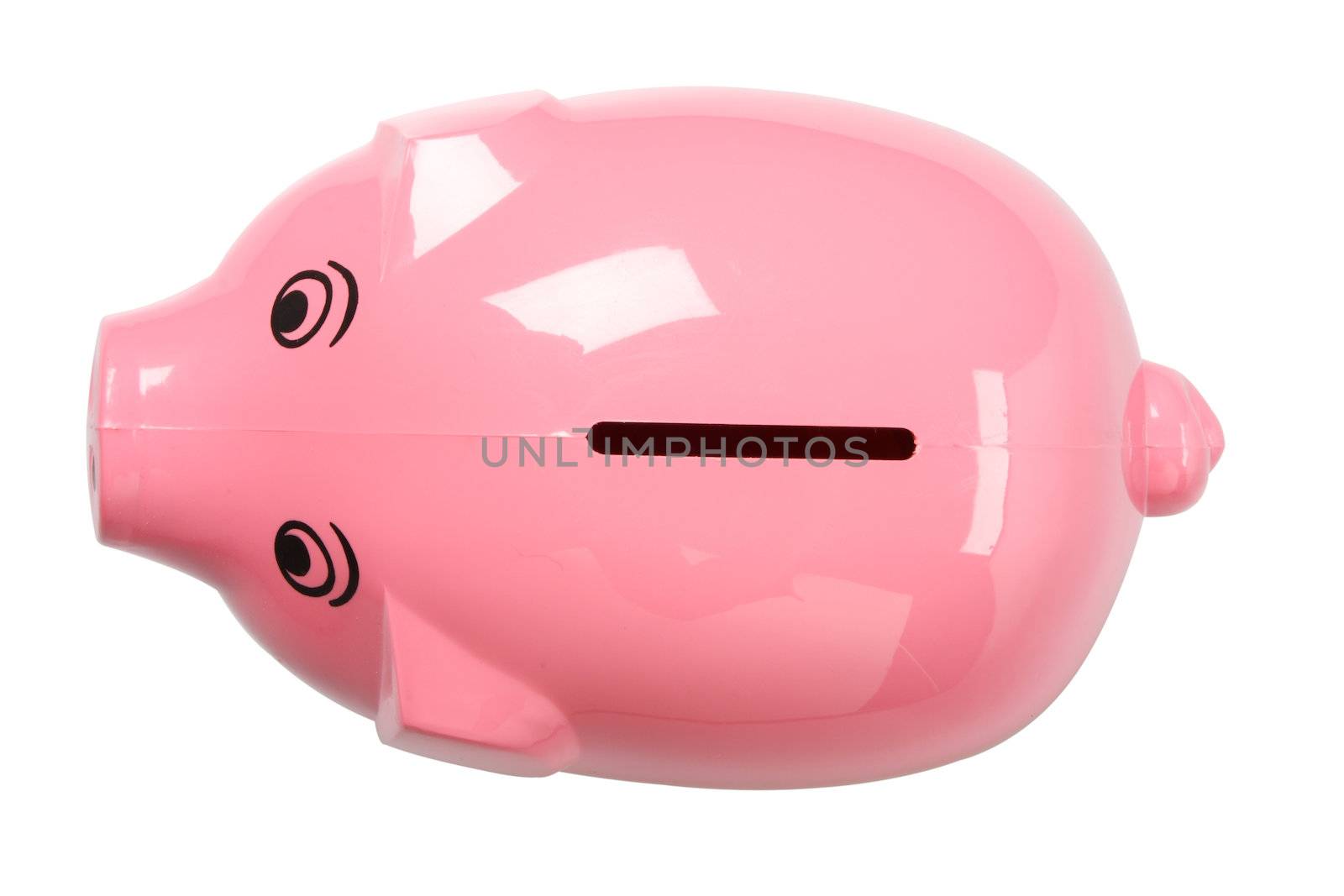 A pink piggy bank isolated on white, shot from above, clipping path included