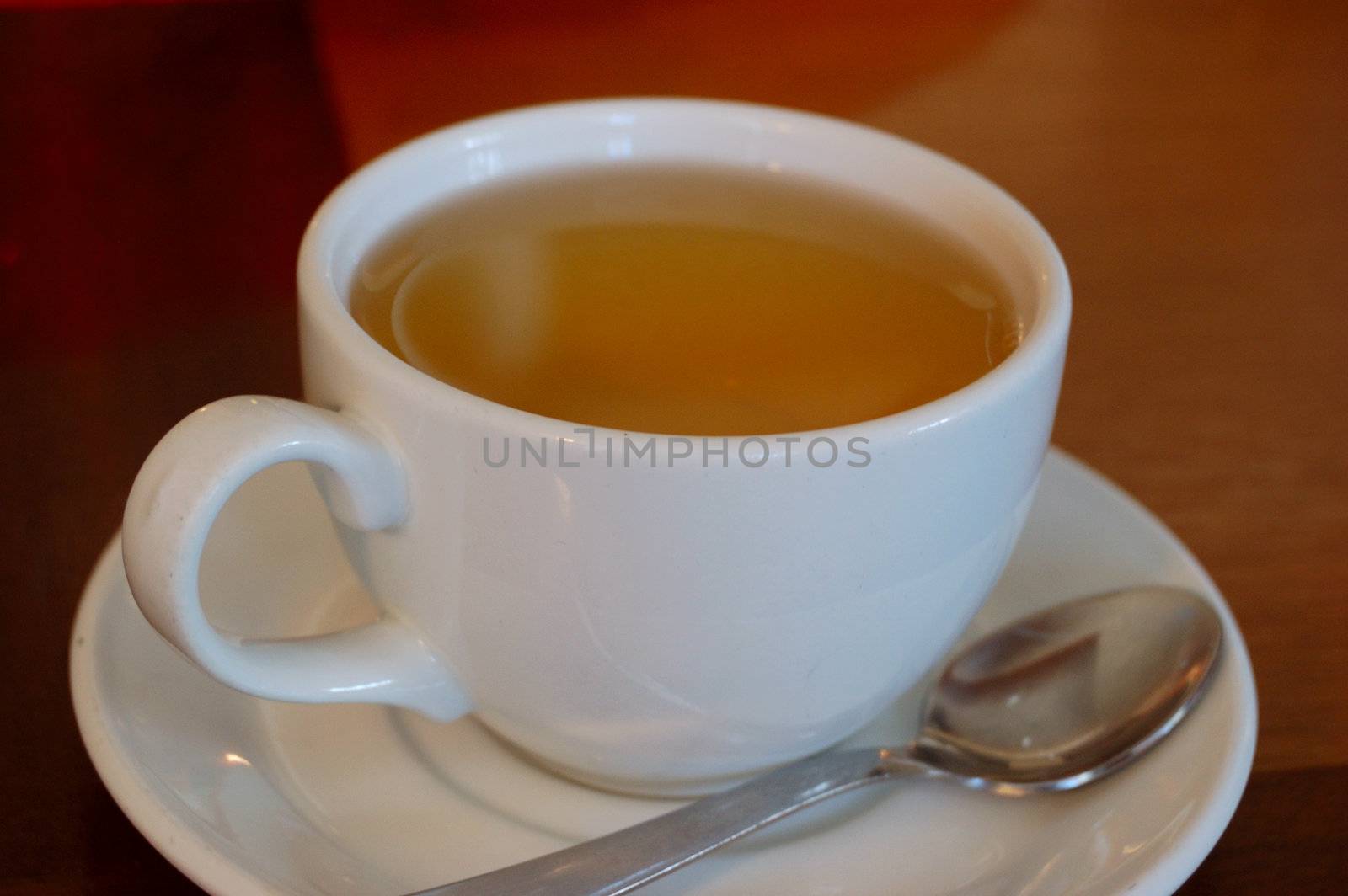 Close-up of white teacup  of green tea