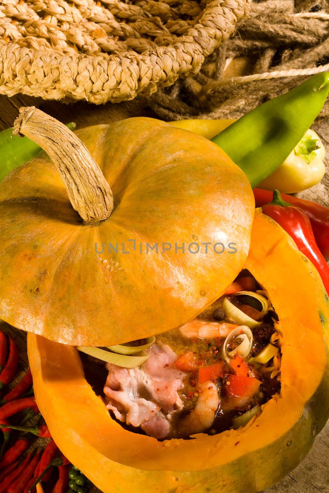 Soup with prawn and meat in pumpkin