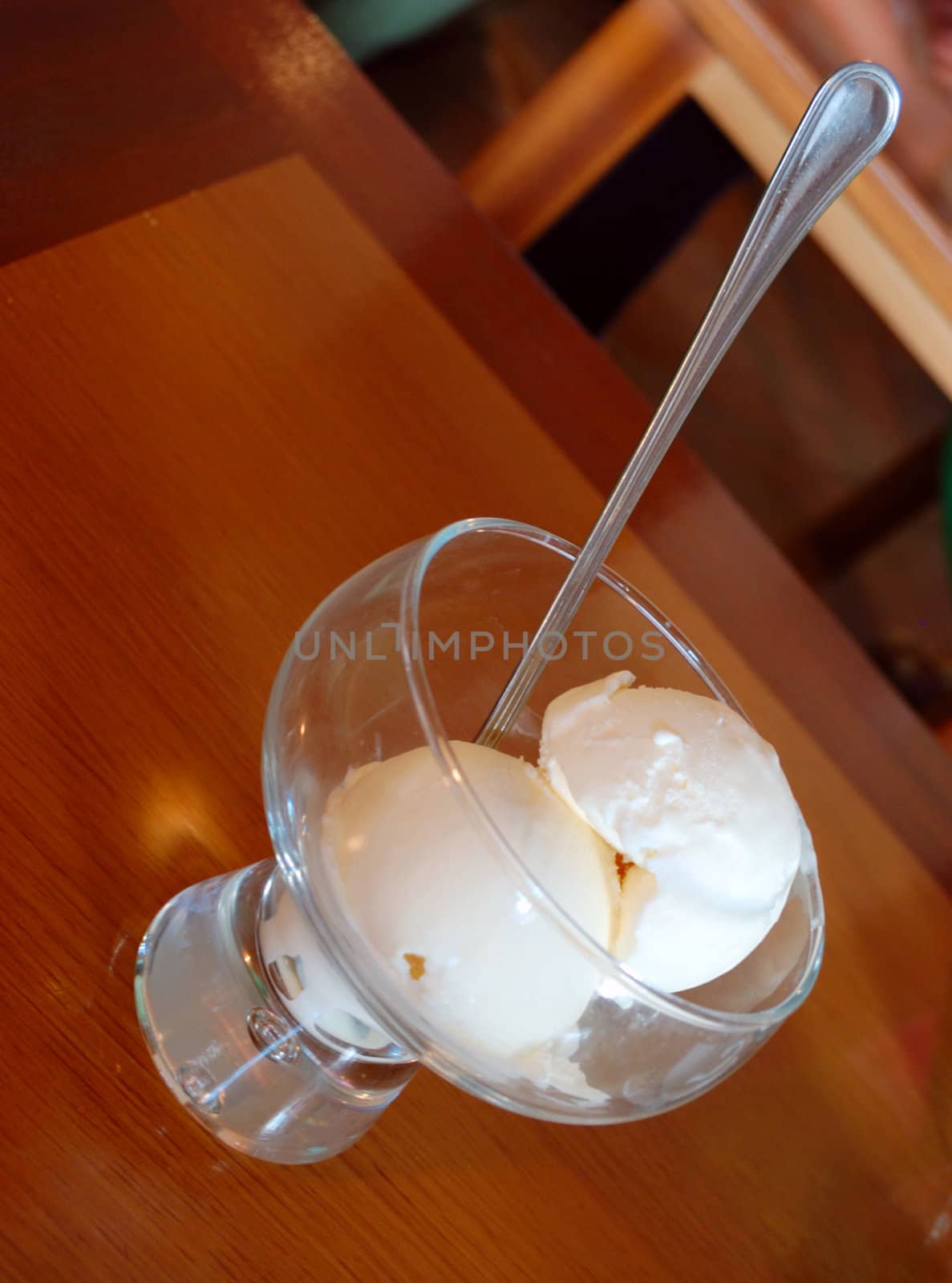 Close-up of white ice cream with spoon in