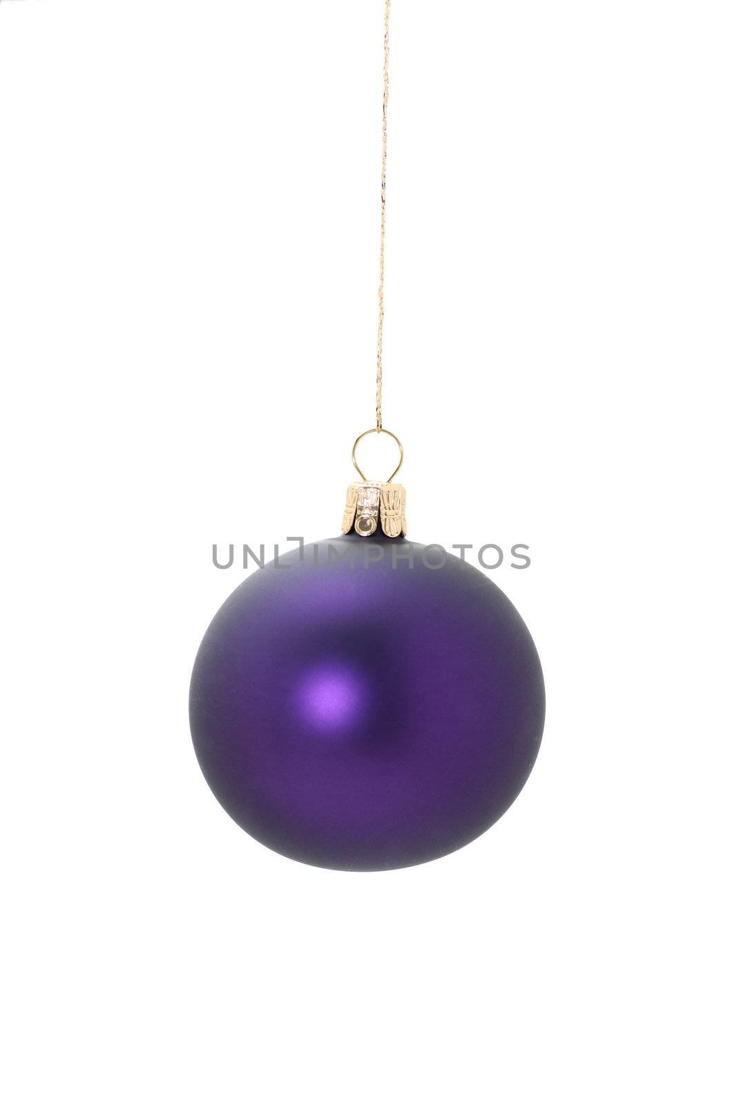 A violet christmas ball hanging from golden thread, shot in studio isolated on white. Perfect for your holiday designs or ads