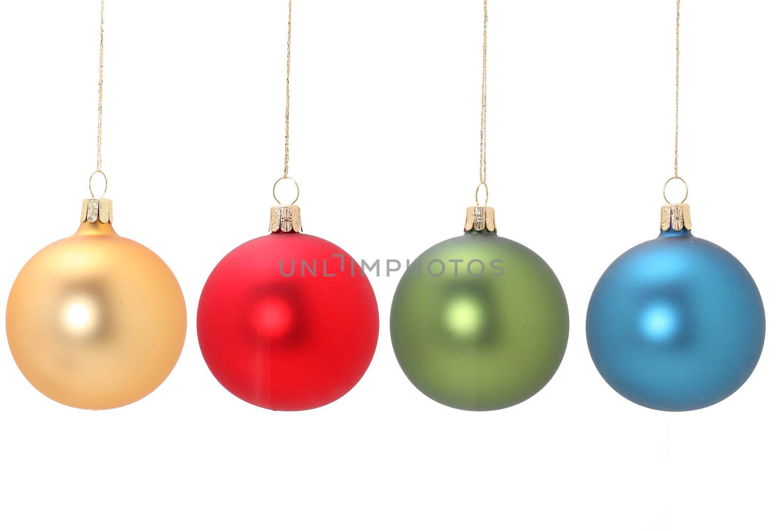 Four christmas balls hanging from golden thread, Gold, Red Green and Blue, shot in studio isolated on white. postprocessing minimal, only levels and saturation. Perfect for your holiday designs or ads