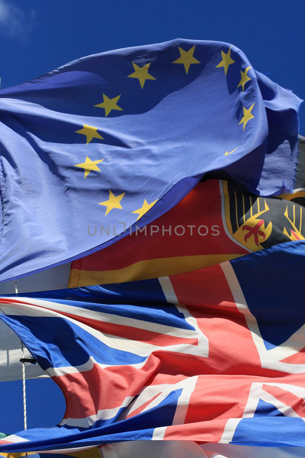 The national flags of UK and Germany along with the European Union flag all flying together, thight shot. Fantastic generic image for anything regarding the EU, UK, Germany or anything European