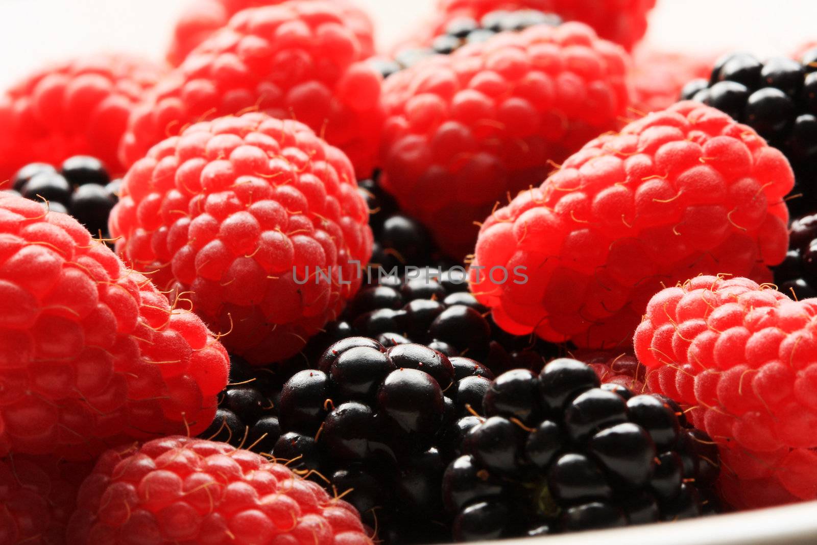 raspberries and blackberries by sumos
