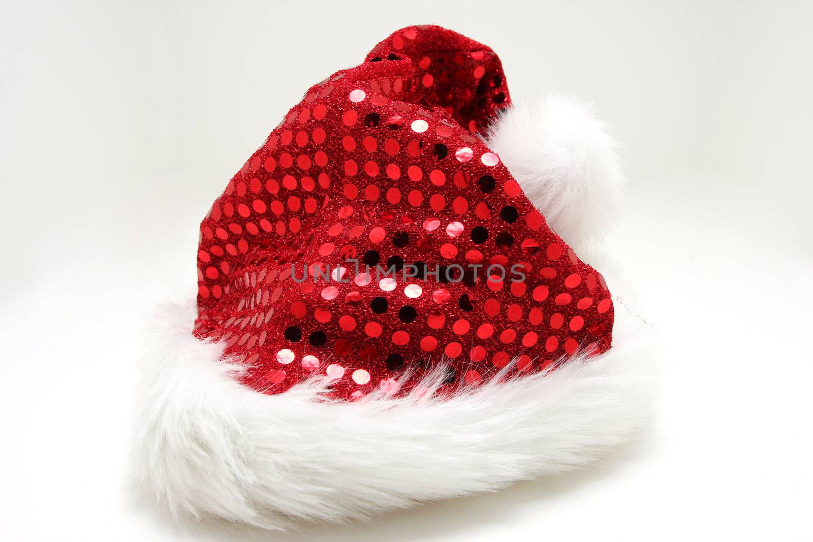 Santas hat on white, red glittering shingles on hat