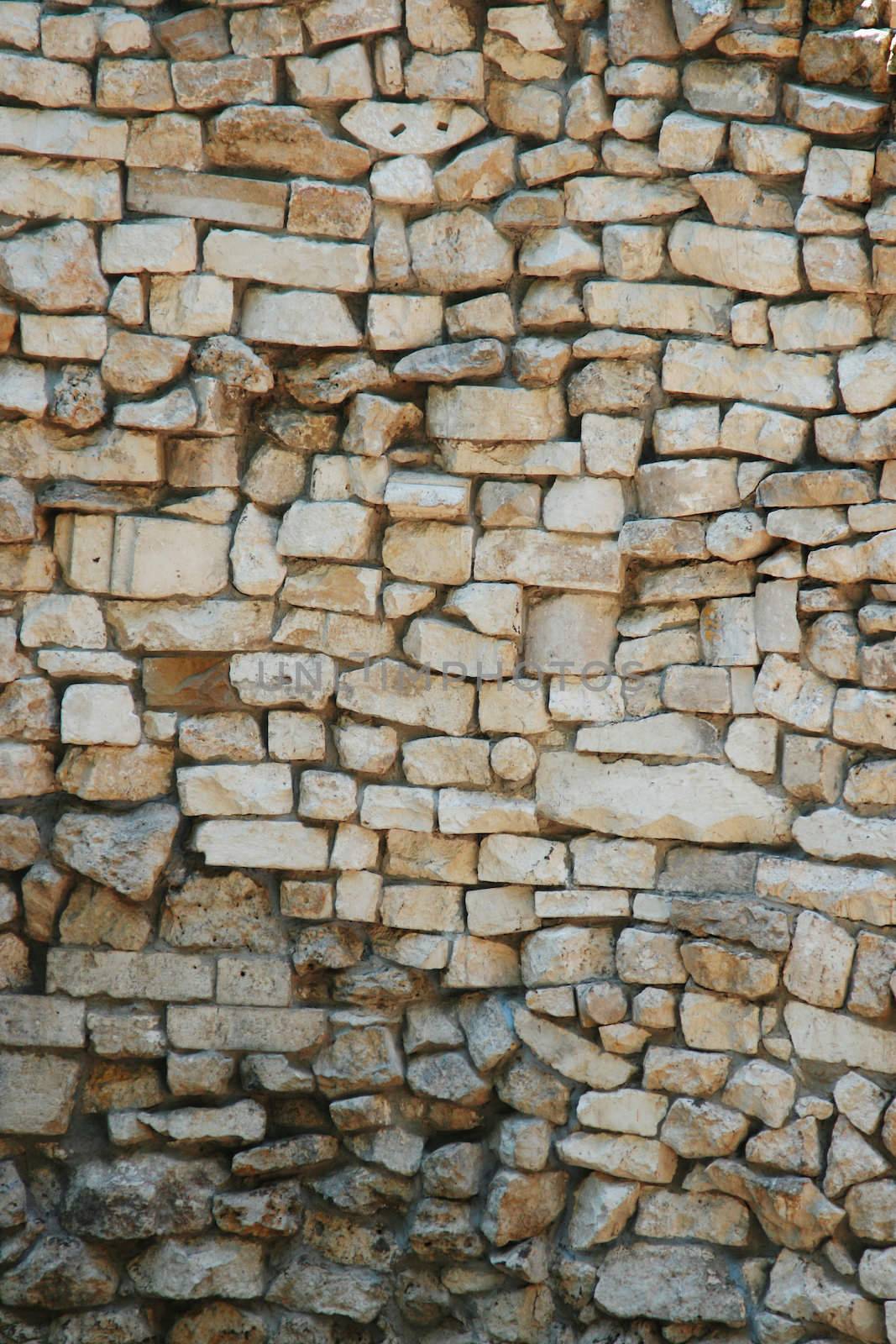 Ancient wall from a stone and a brick