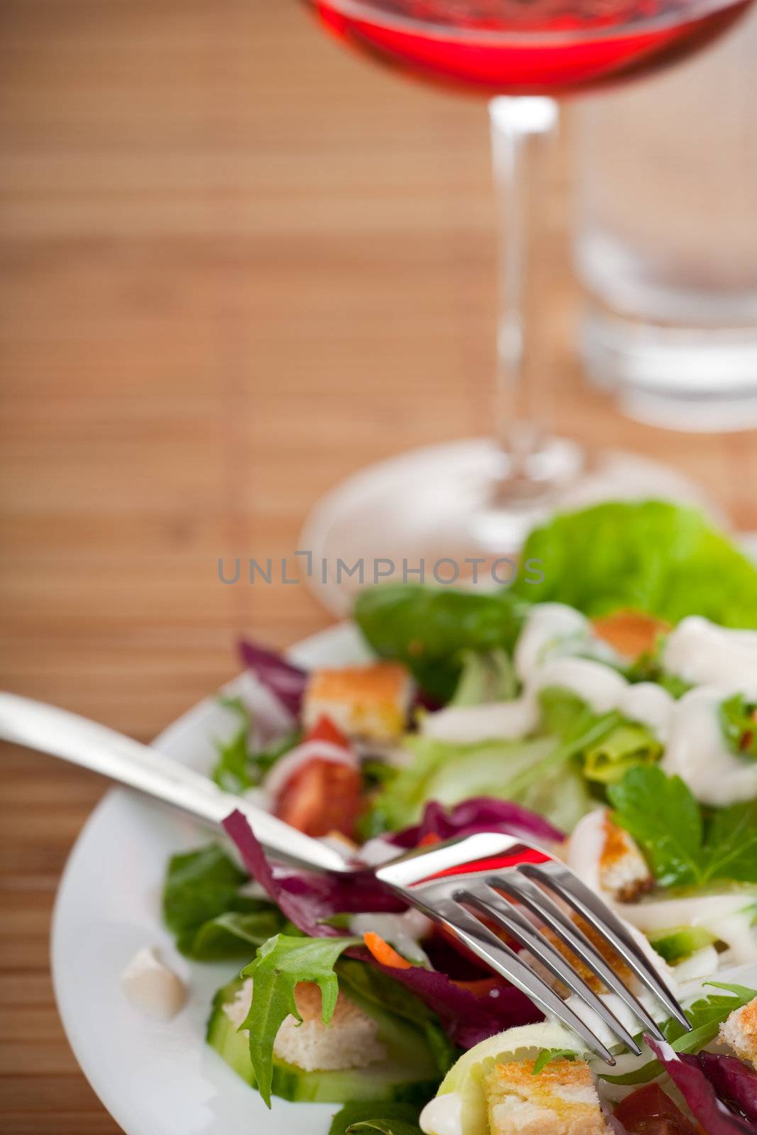 fork on a plate with salad