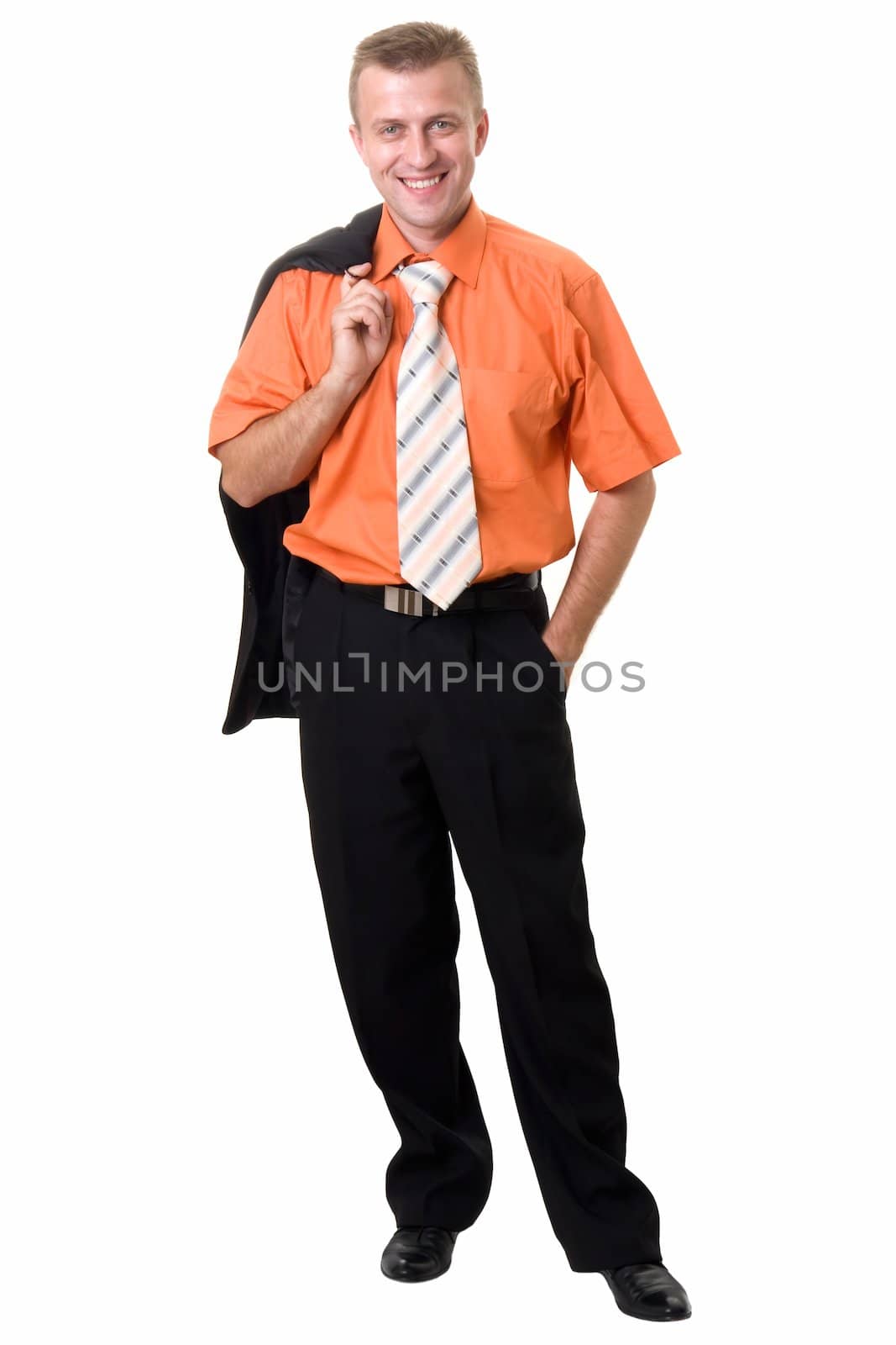 The smiling young man stands on a white background.