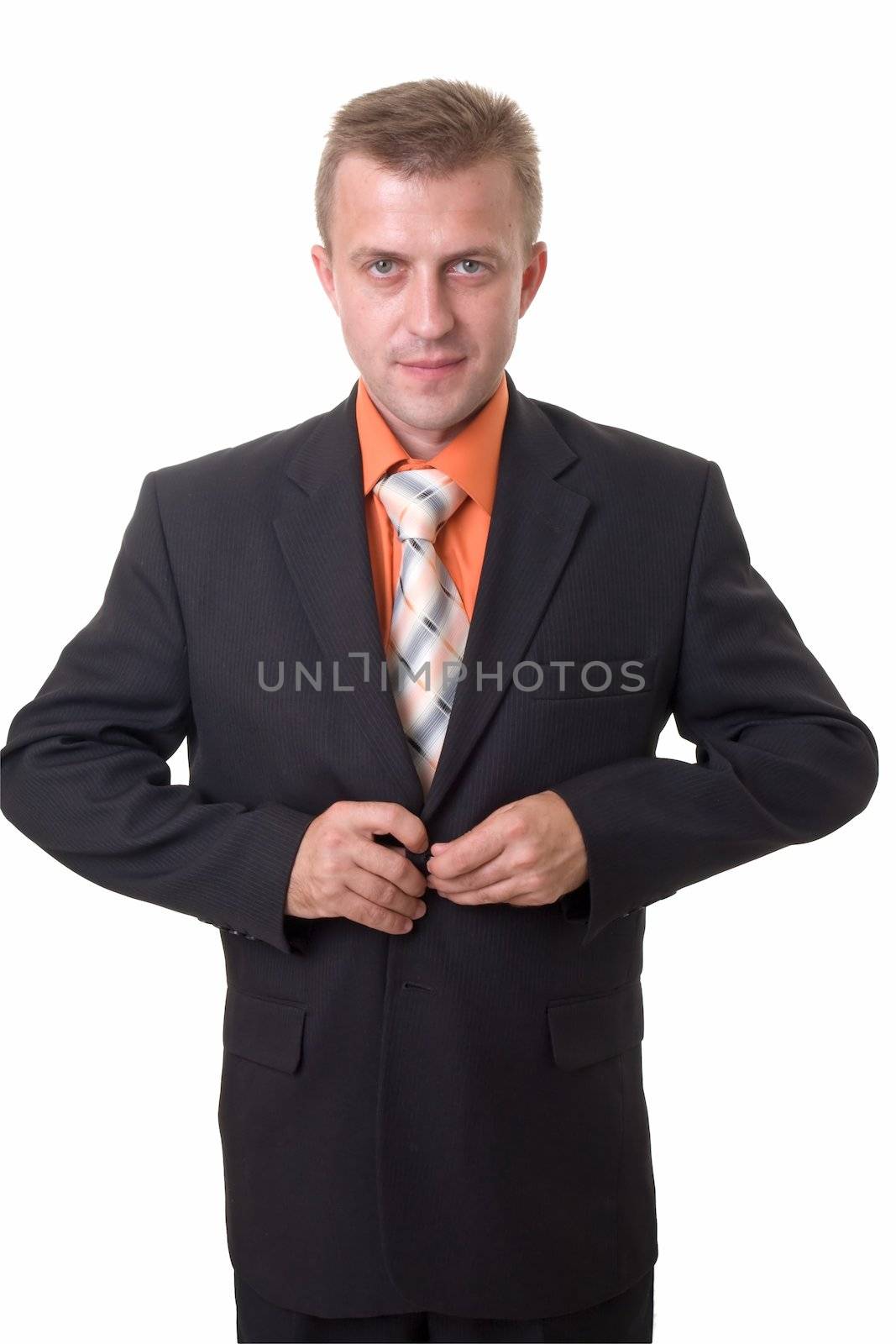 serious young man clasps button oneself up on a white background 