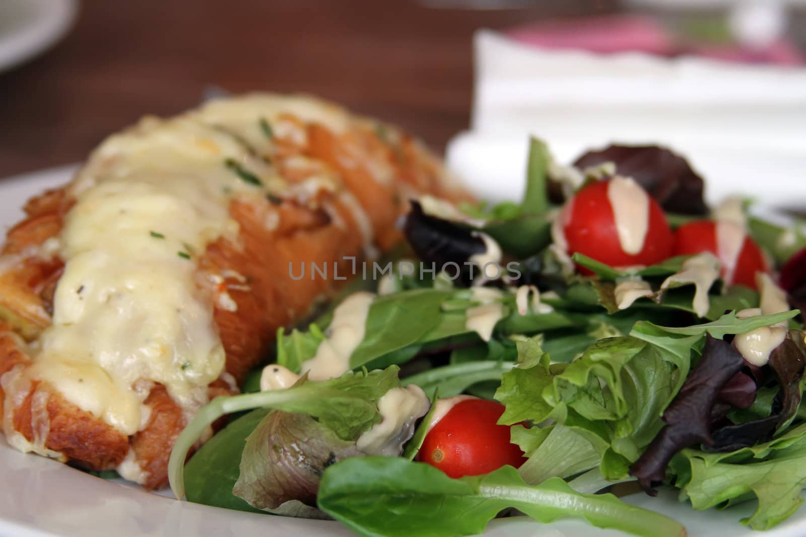Chicken Croissant with cheese and a side of salad