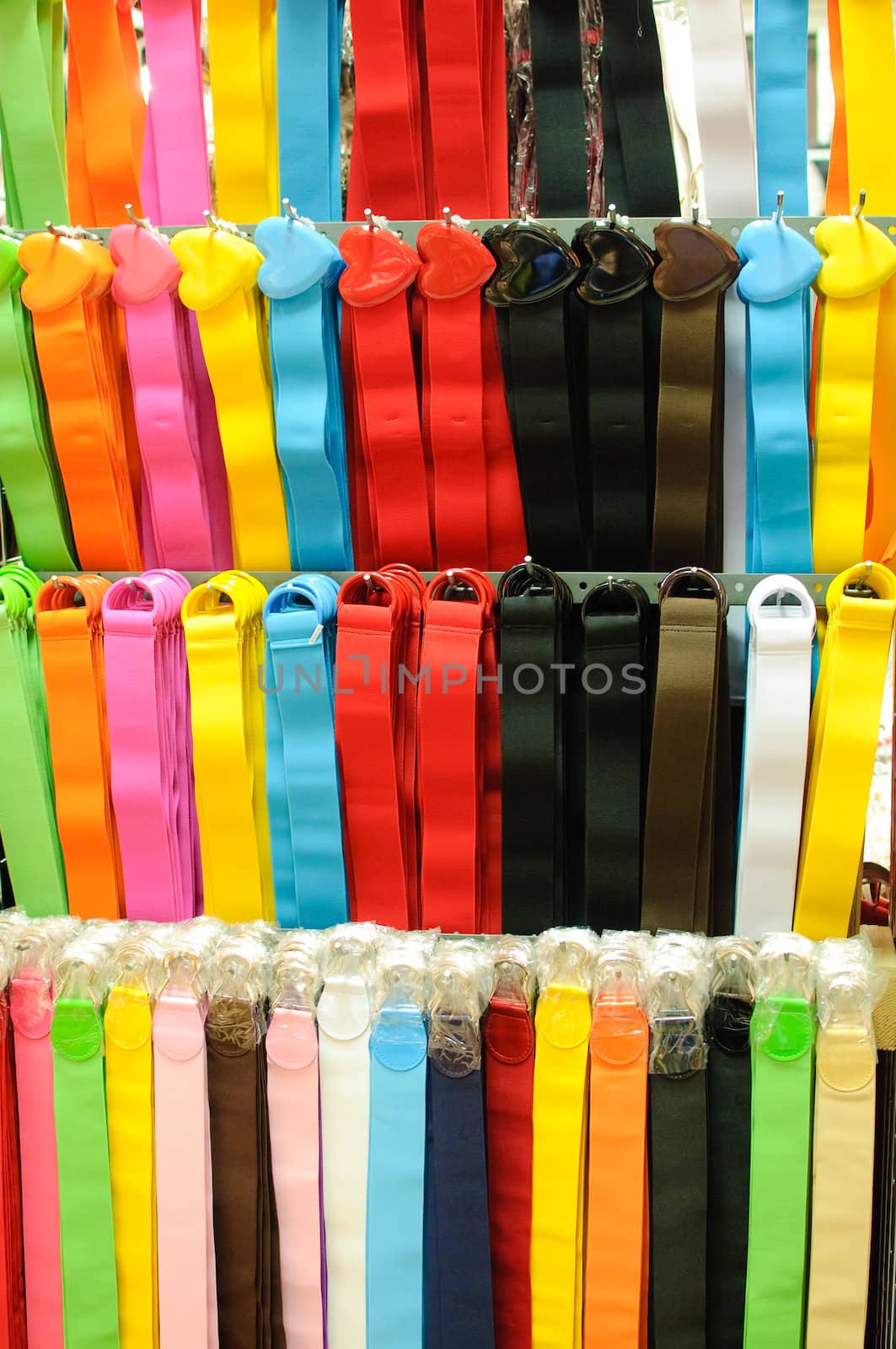 a display of colorful belts.
