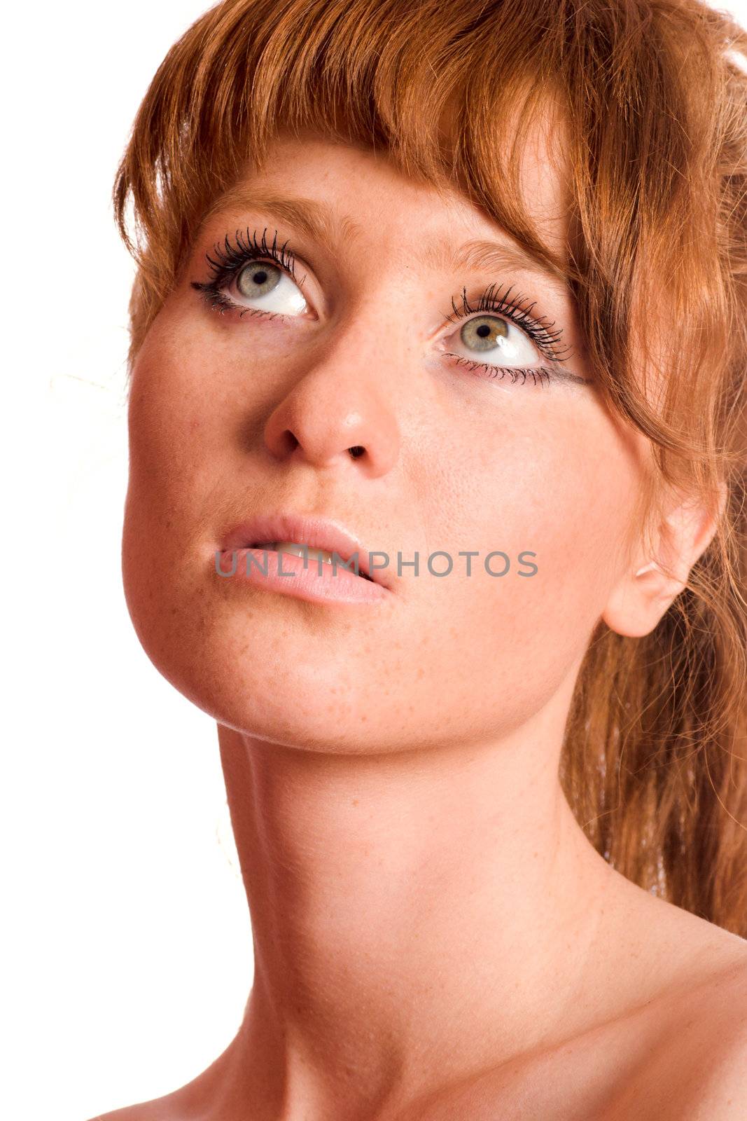 Portrait of young redhead woman with freckles isolated on white