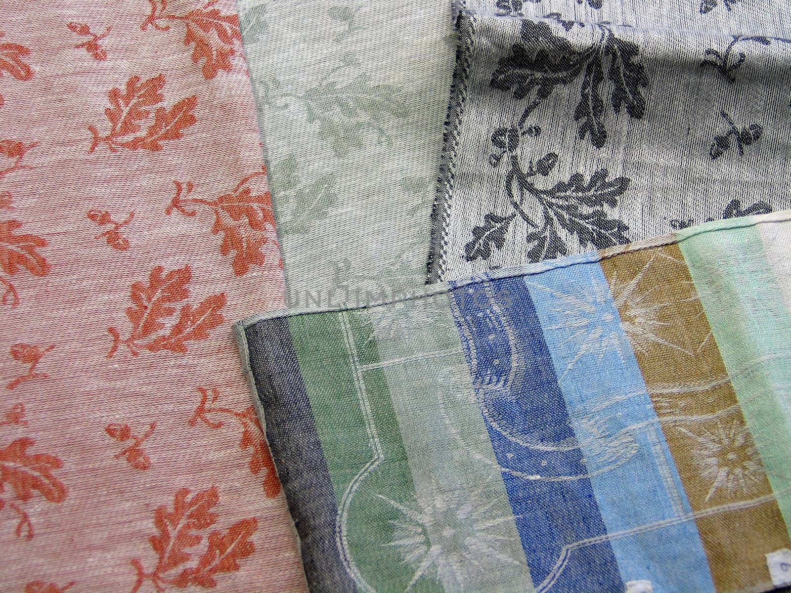Colorful textile background - display of hand made flax linen fabrics