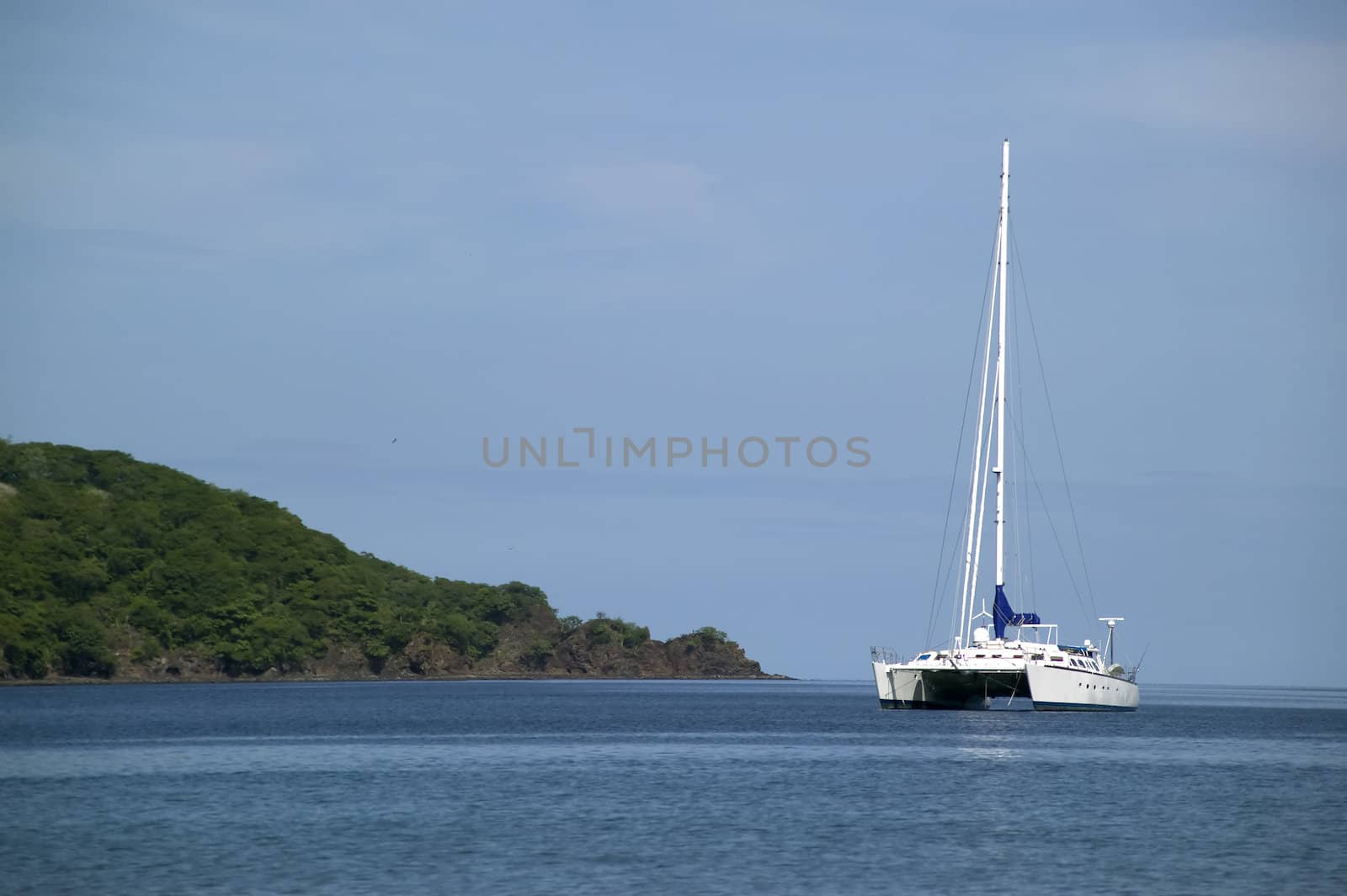 Expensive catamaran off shore on the horizon 