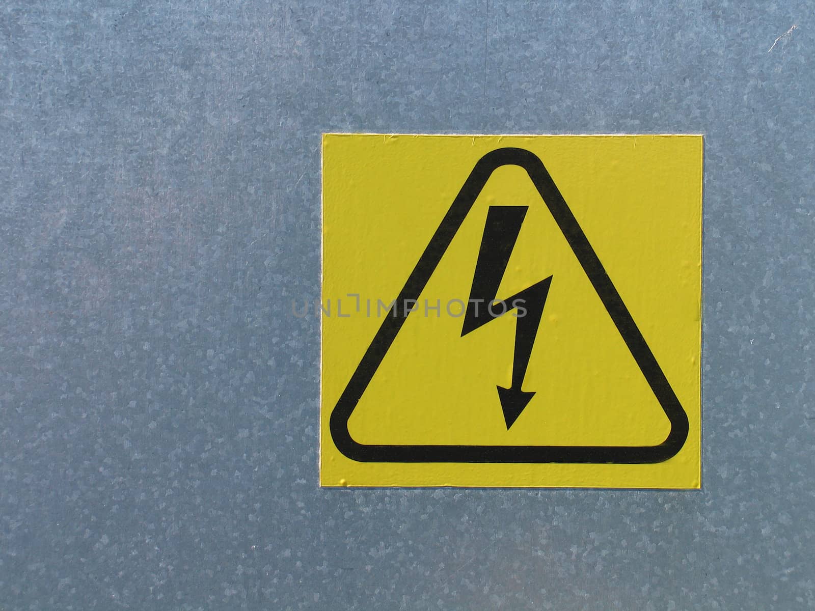 High voltage electricity warning sign mounted on a wall
