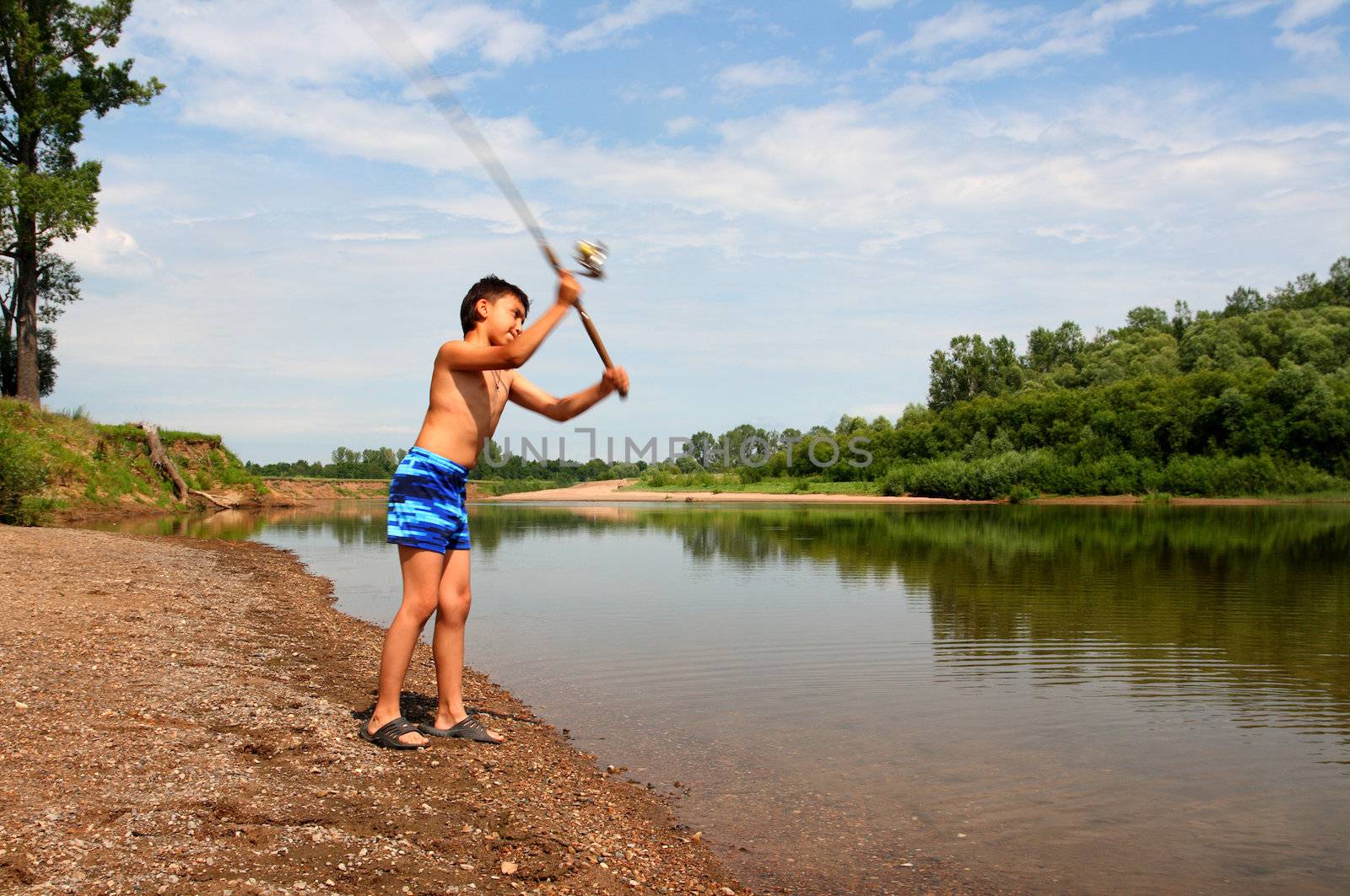 boy fishing with spinning by Mikko
