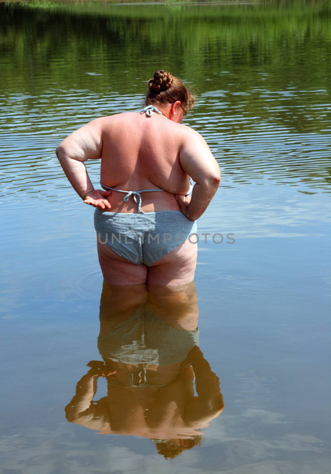 overweight woman bath in river