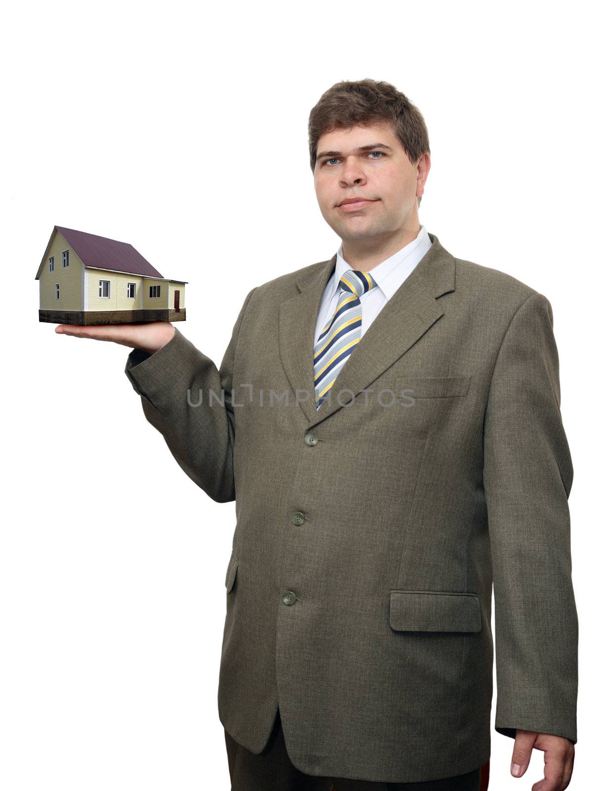 businessman with house in hand by Mikko