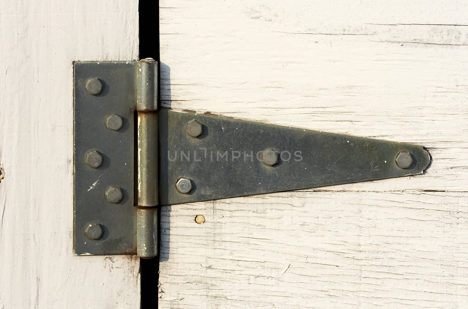 a close up picture of hinge on door