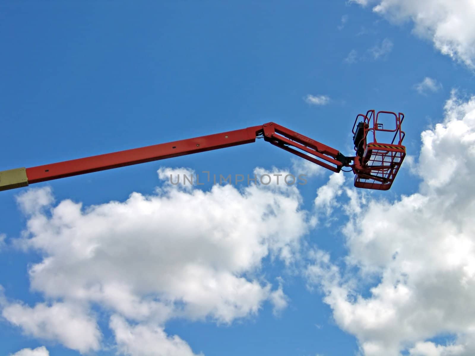 Crane with hydraulic boom lifted up sky background