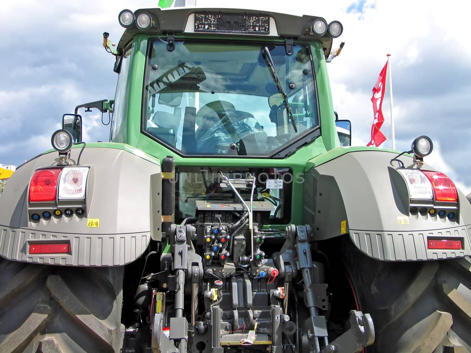Modern new tractor in rear view
