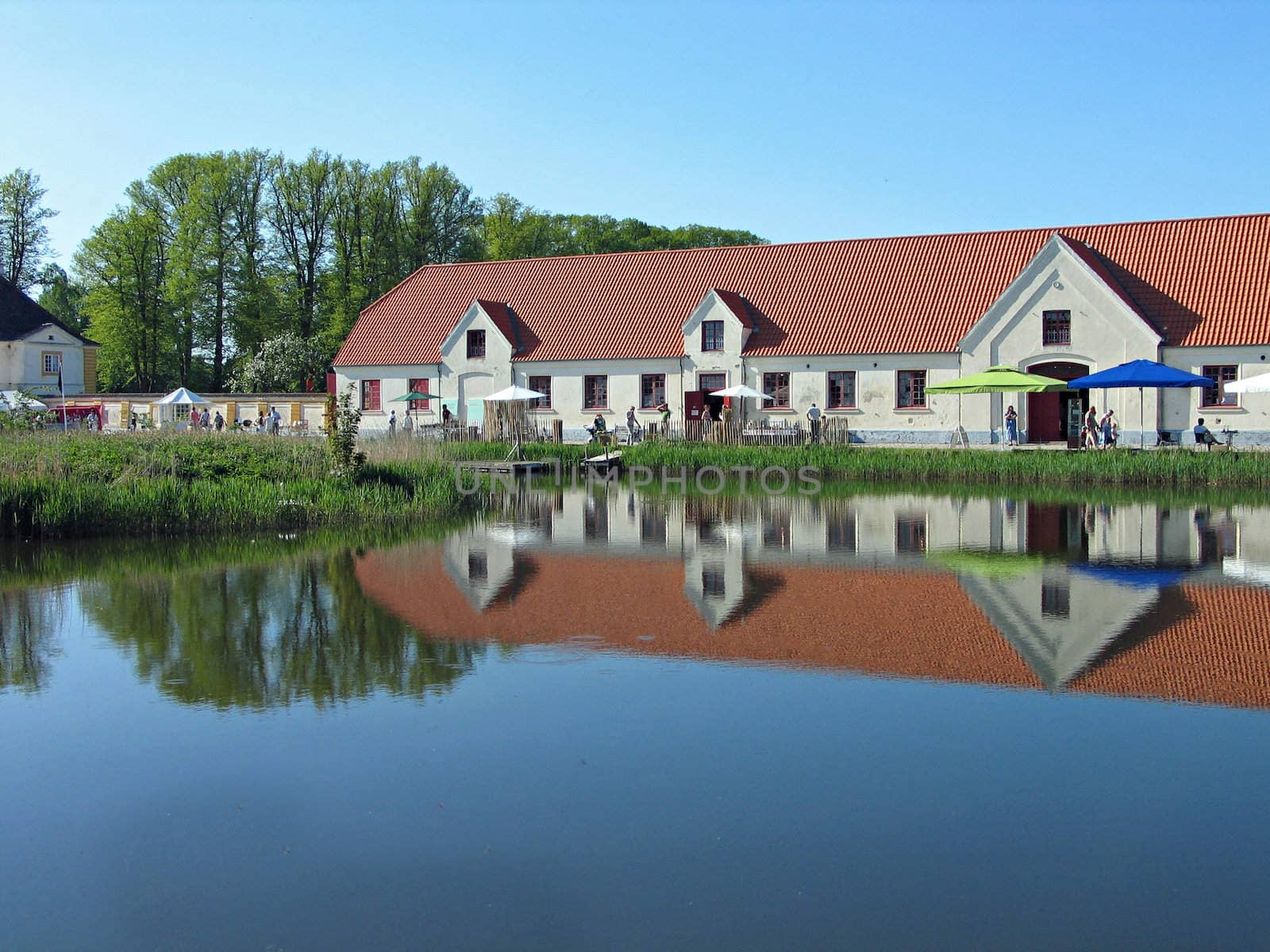 Castle buildings reflected in the water Valdemar Slot Denmark