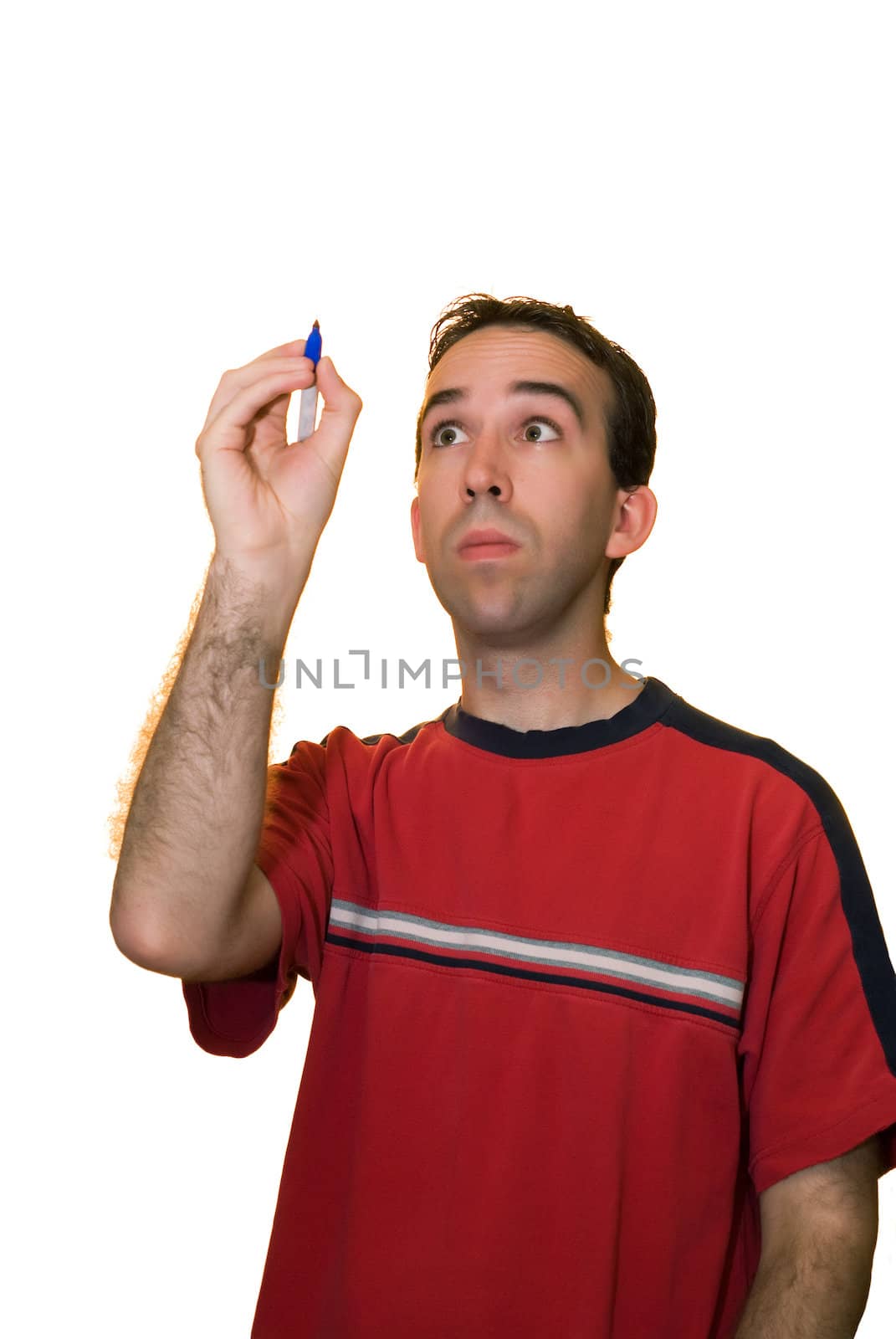A young man wearing a red shirt, writing your text on a piece of glass in front of him
