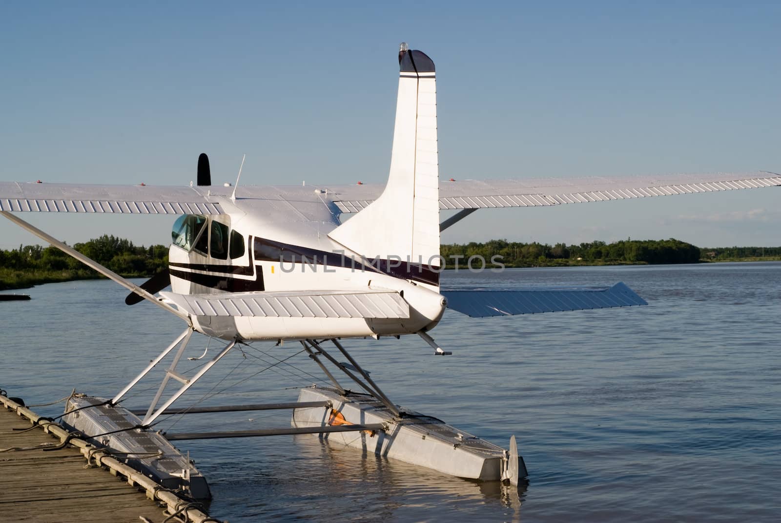A rear view of a seaplane with the engine shut off