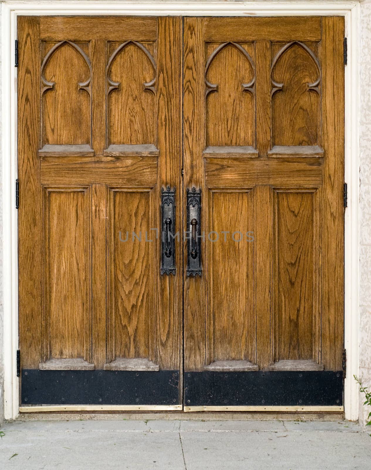 A set of large closed wooden doors