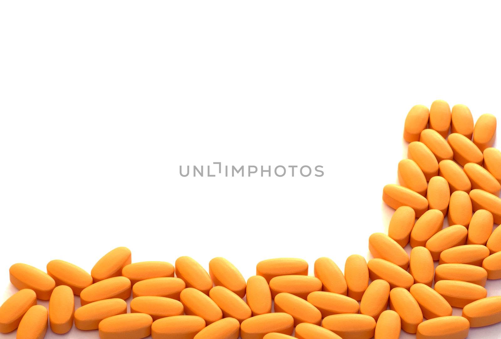 Border of medicinal pills, isolated on a white background