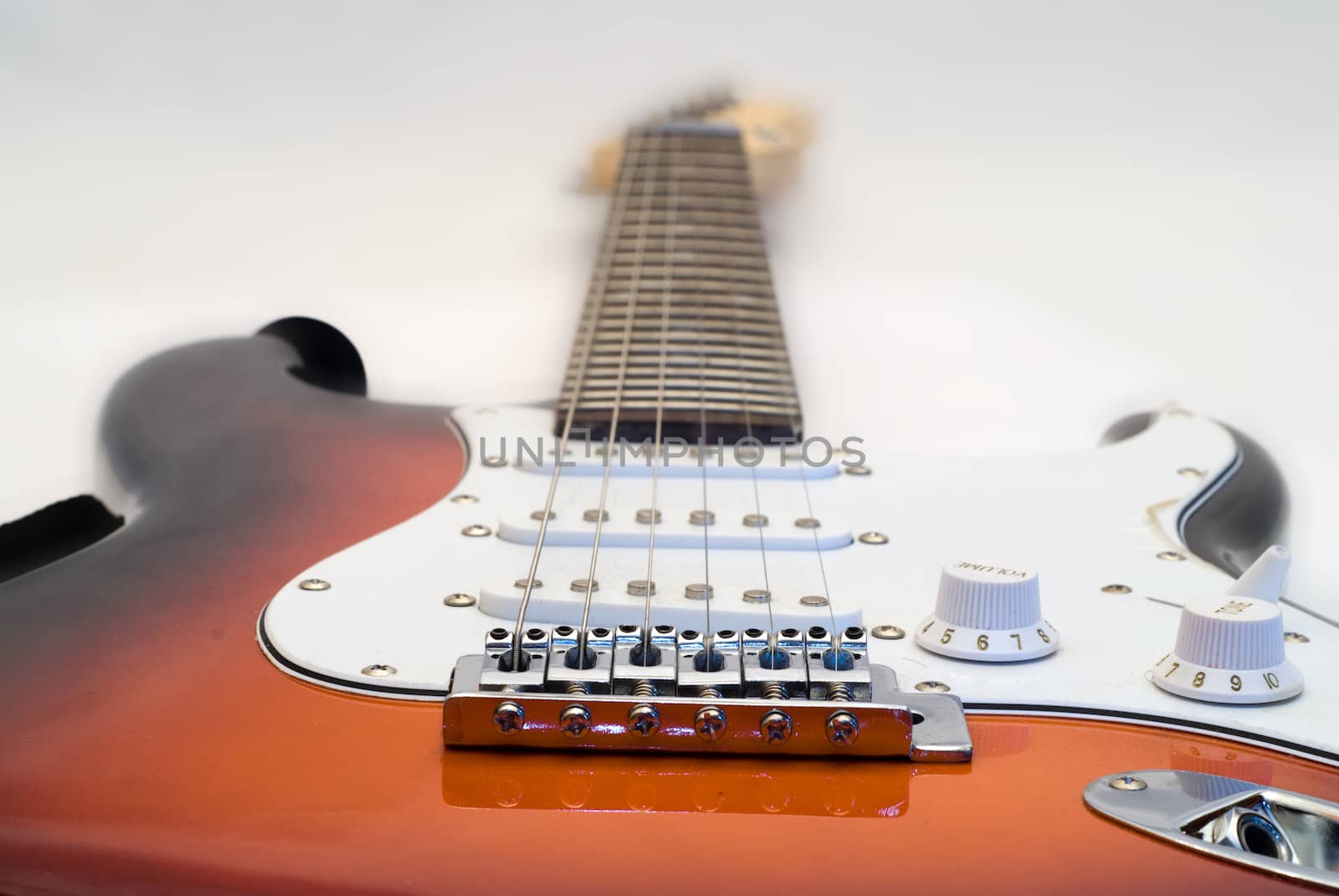 Low angle view of an electric guitar shot on white