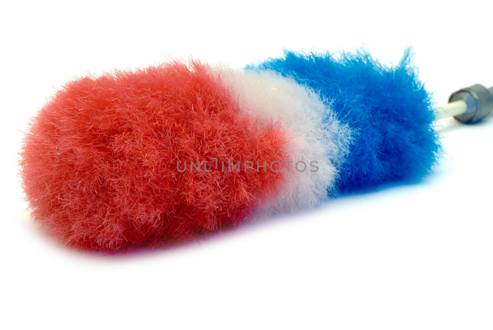 A red white and blue feather duster, isolated on a white background