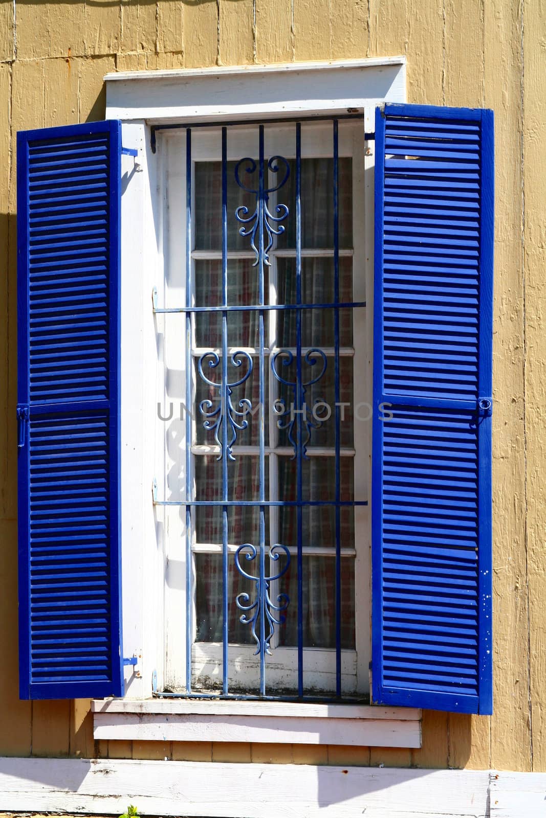 A home in Key West with blue shutters.