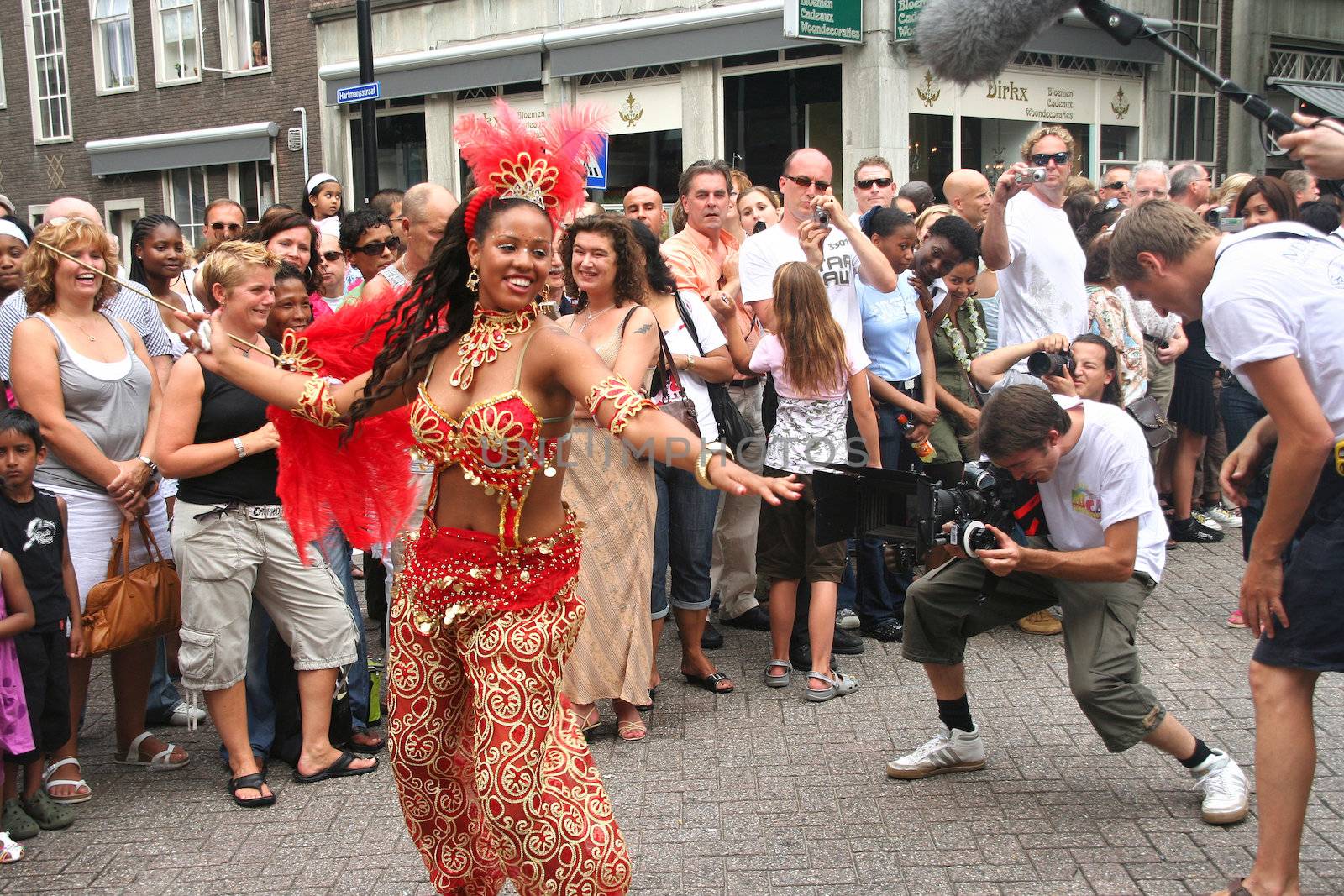 ROTTERDAM - SUMMER CARNIVAL, JULY 26, 2008. Carnival dancer being filmed by TV crew at the Caribbean Carnival in Rotterdam.