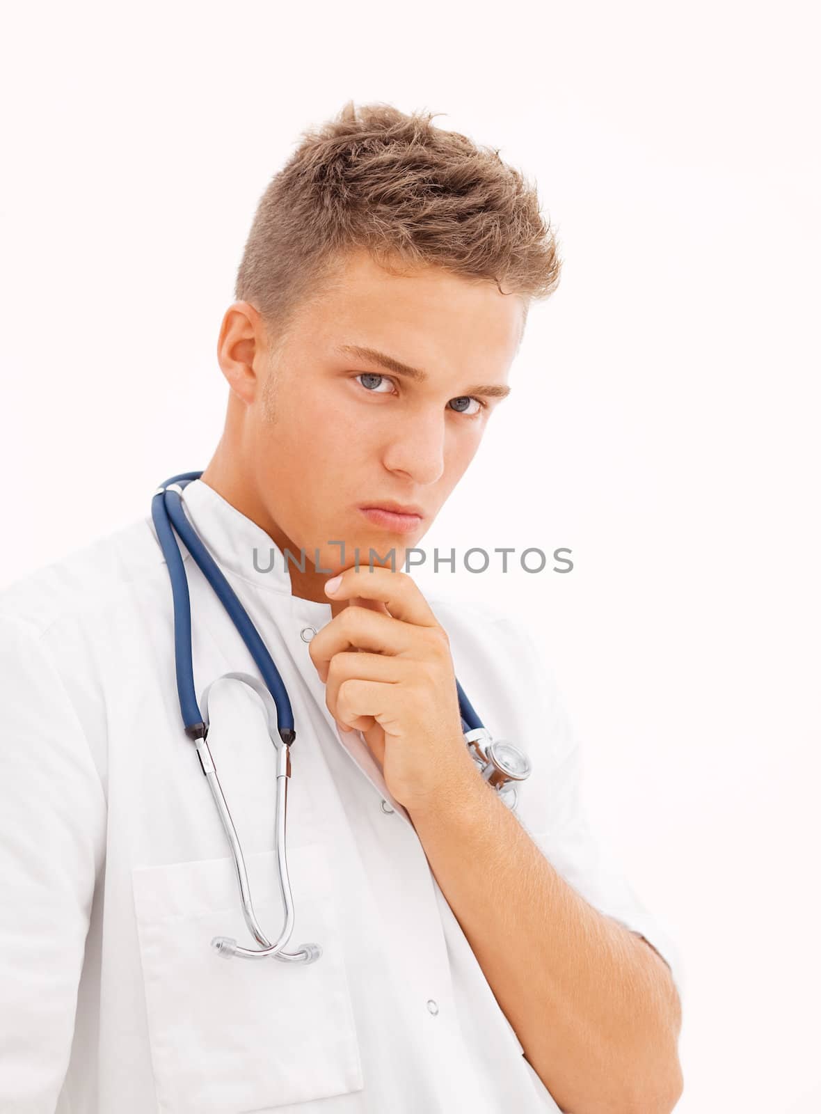 Concerned young blond doctor on white background