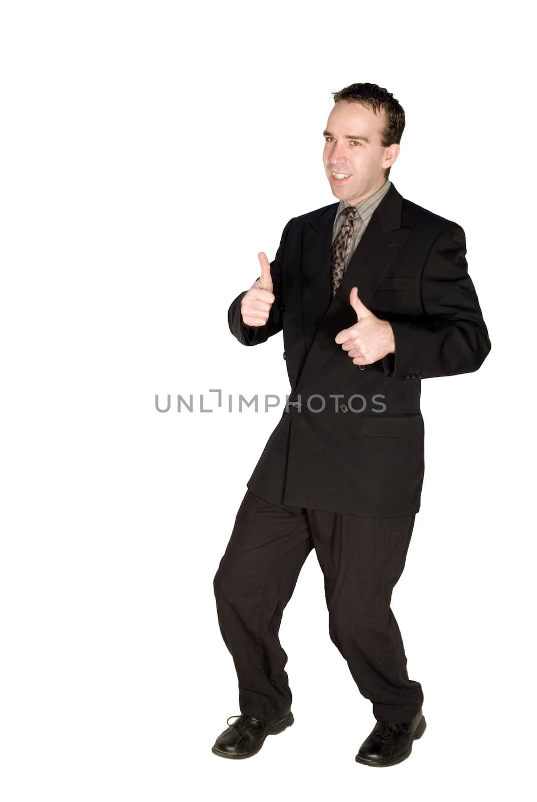 Young good looking businessman gives a thumbs up in response to a promotion