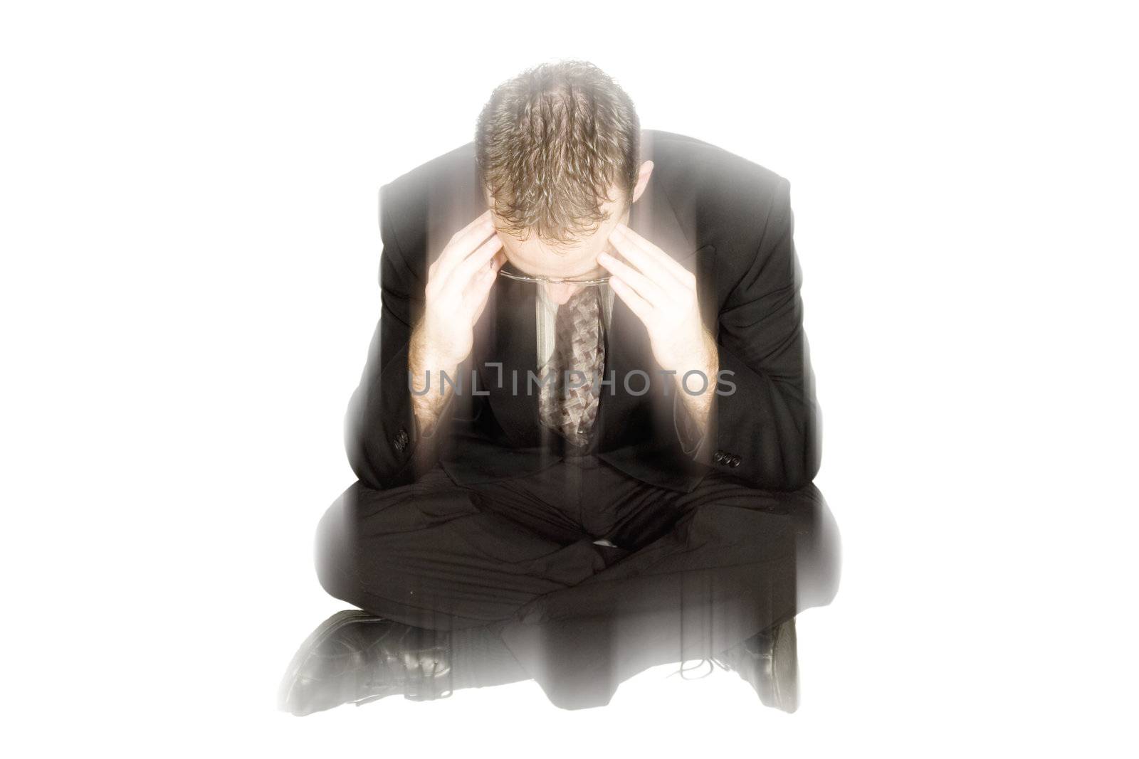 Blurred businessman shows he is in his own world dealing with a migraine