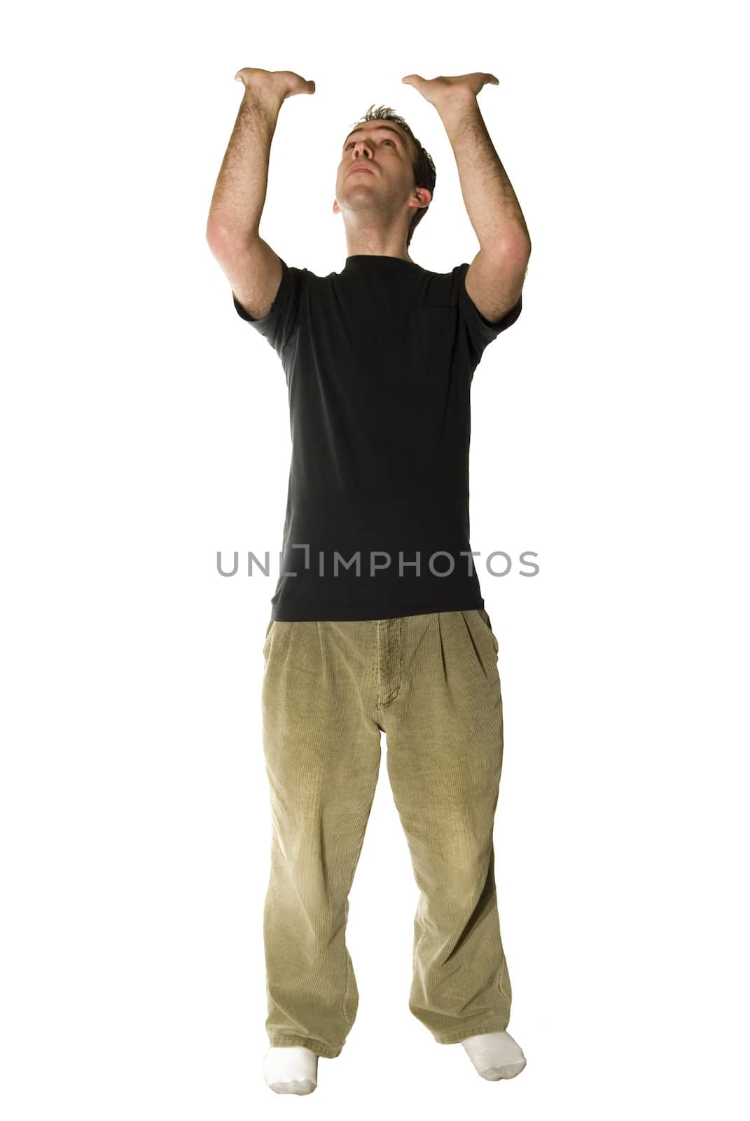 Young man wearing casual clothes, holding up your words or a sign, isolated against a white background