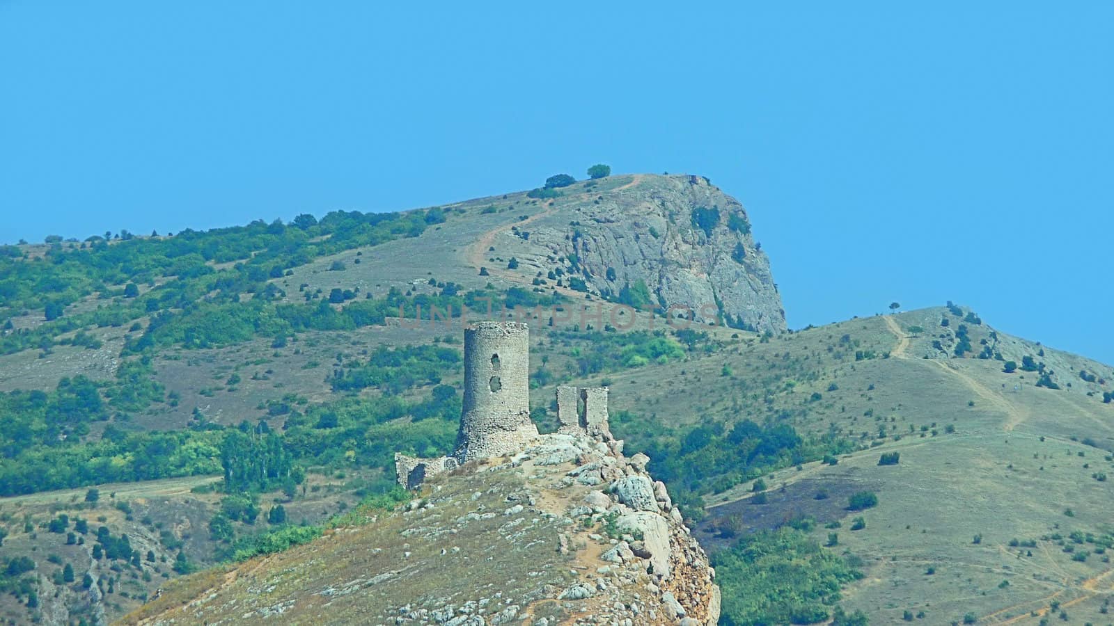Tower of old fortress on a mountain above a city Balaklava