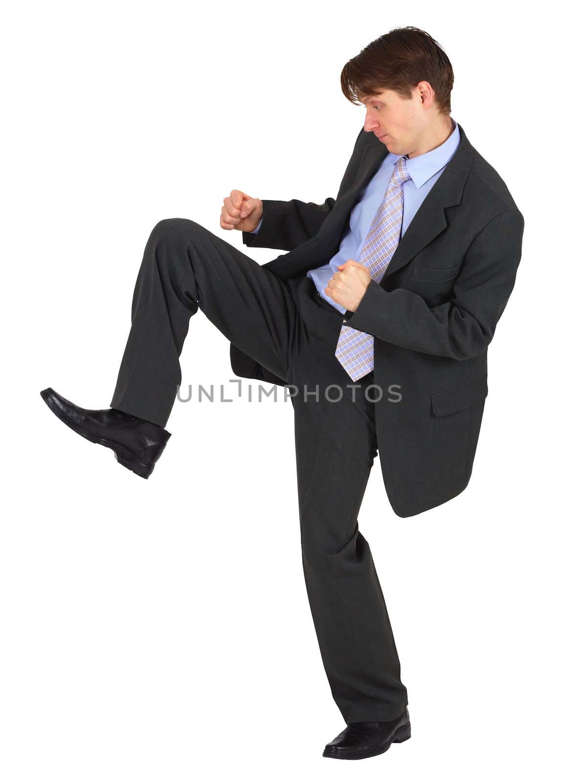 Businessman kicks down, isolated on white background