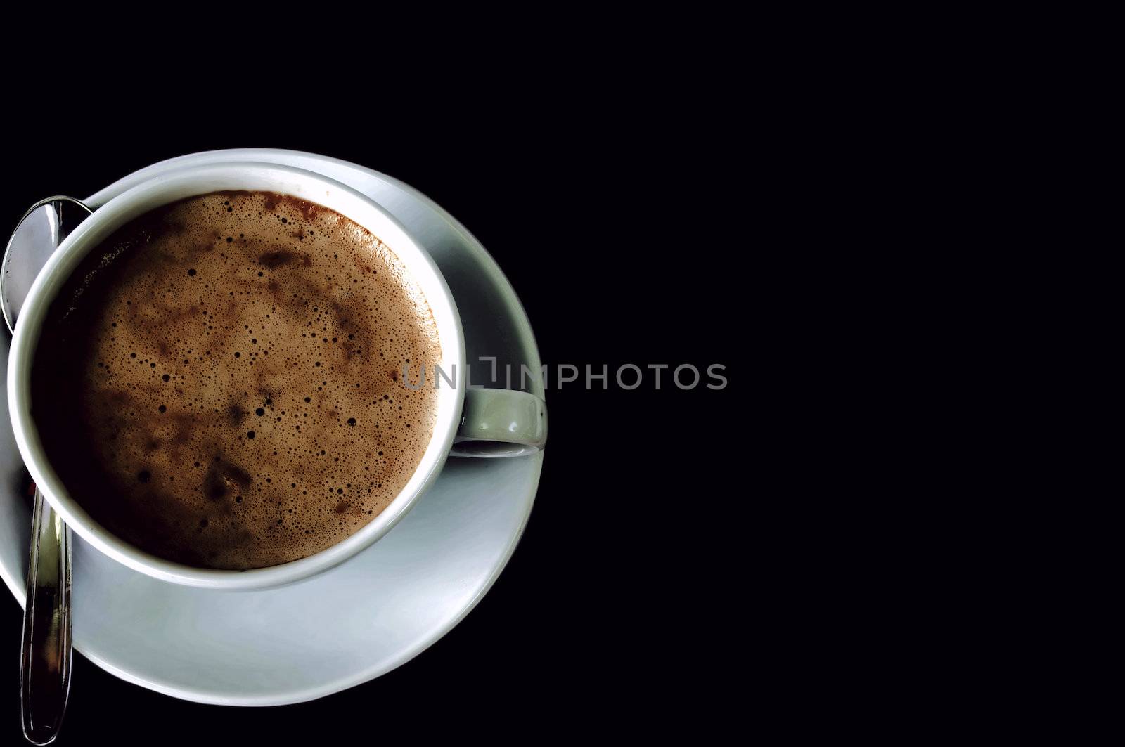 cup of fresh capuccino isolated on black, copy space