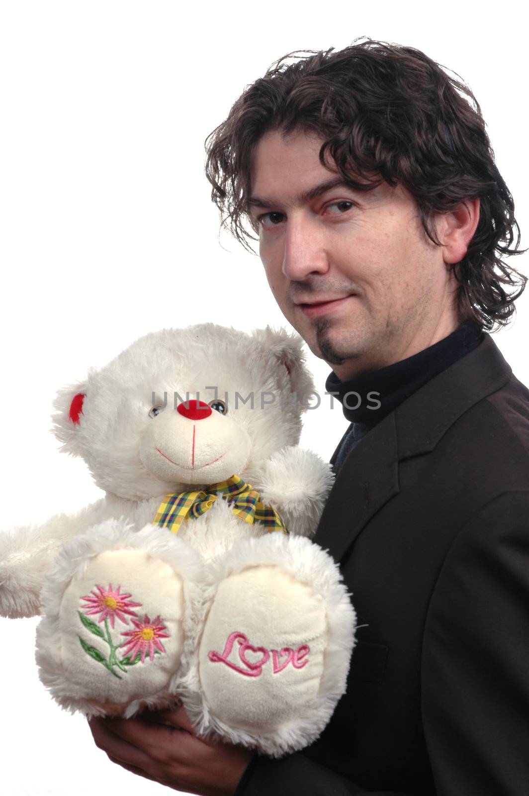 Young businessman holding teddy bear